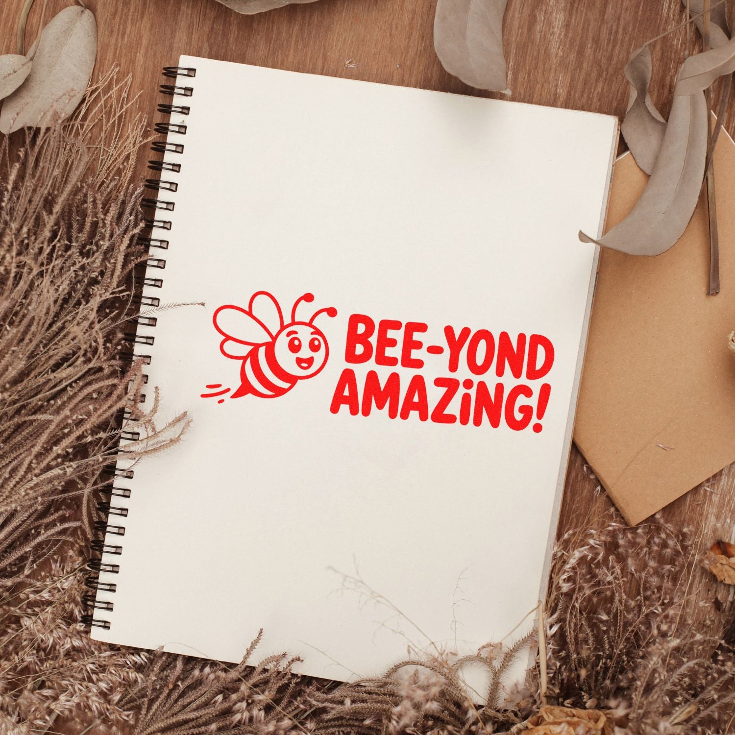 Bee-Yond Amazing bee rubber stamp on notebook page, perfect for card making, scrapbooking, and handmade crafts.
