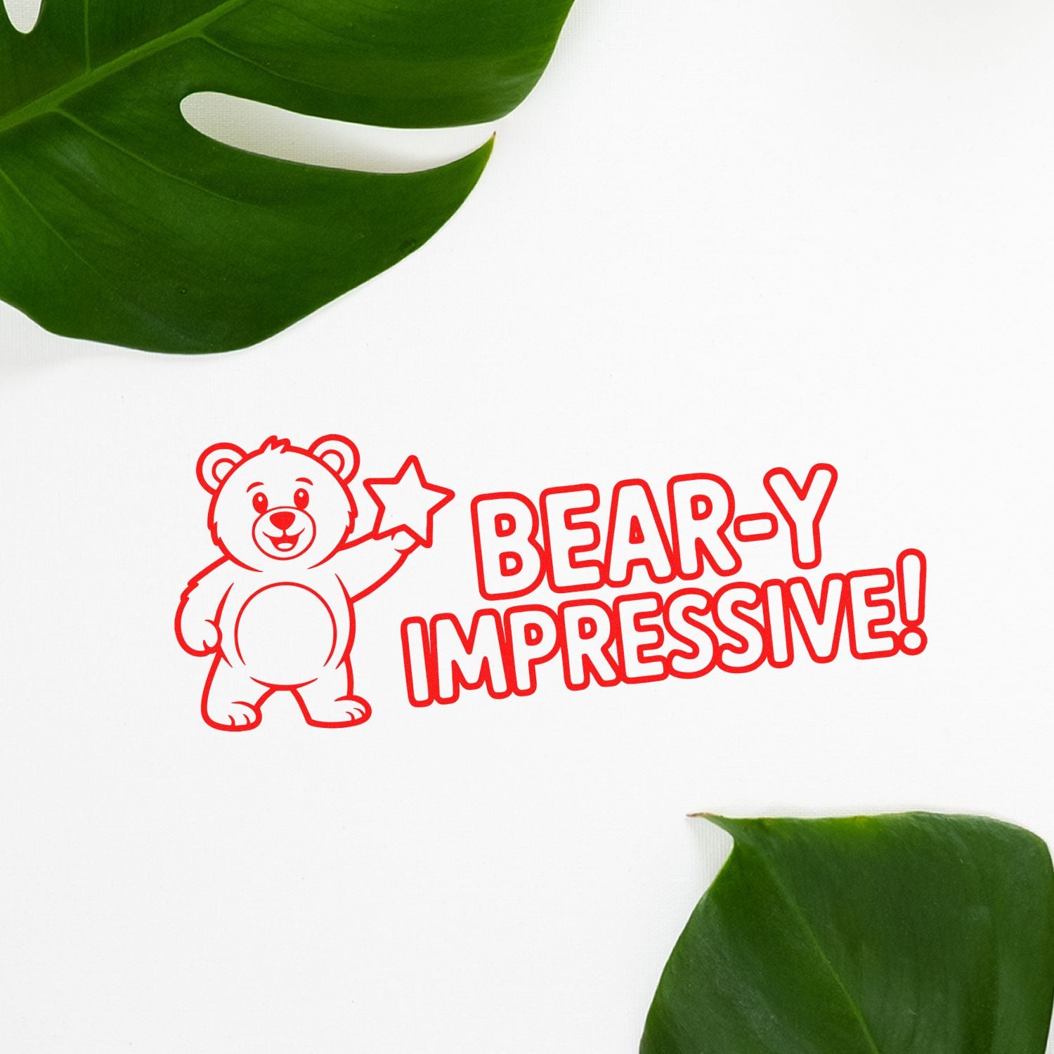 Bear-y Impressive novelty rubber stamp with smiling bear and star, red stamp impression on white background.