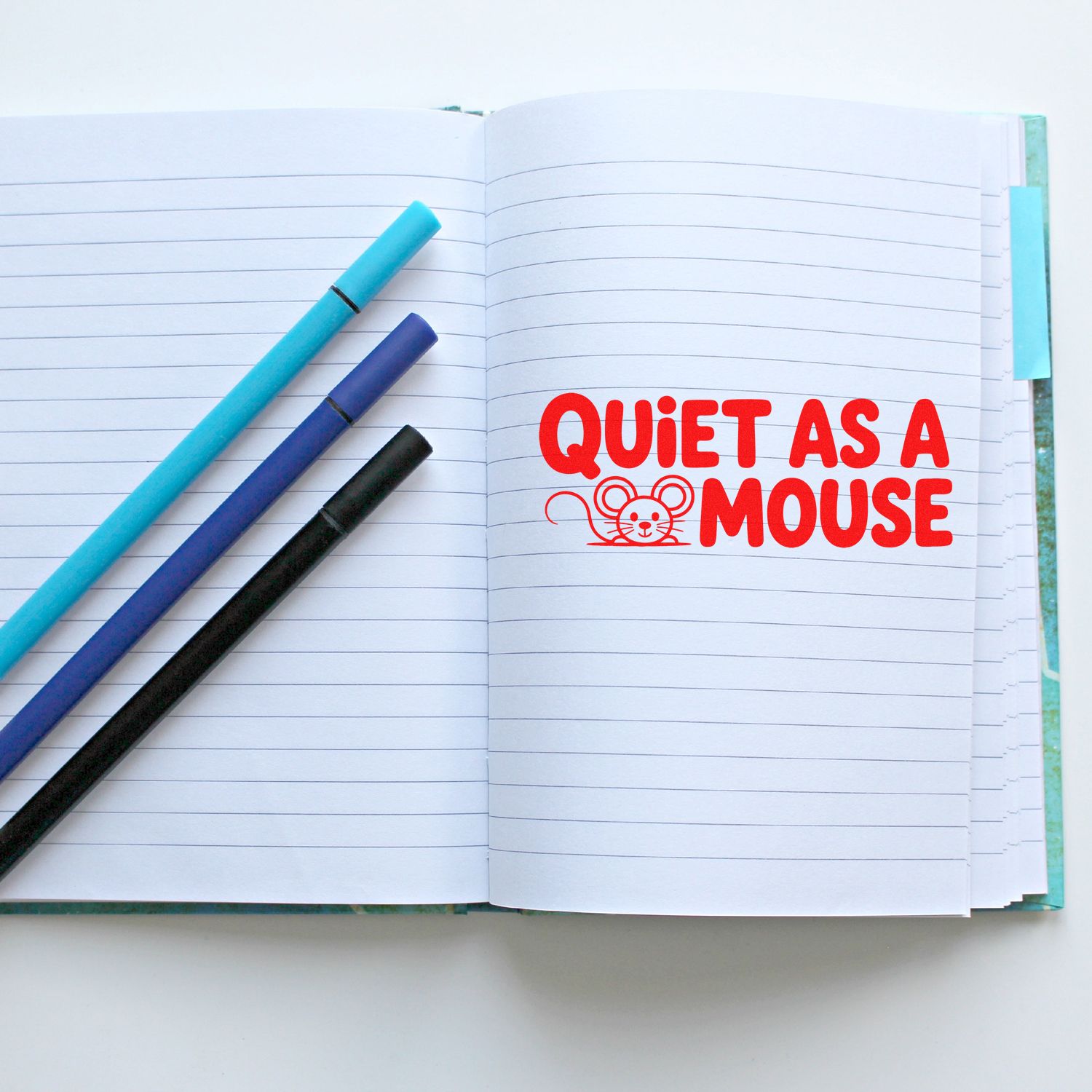 Quiet as a Mouse rubber stamp impression on open notebook, perfect for journaling, planners, and craft projects.
