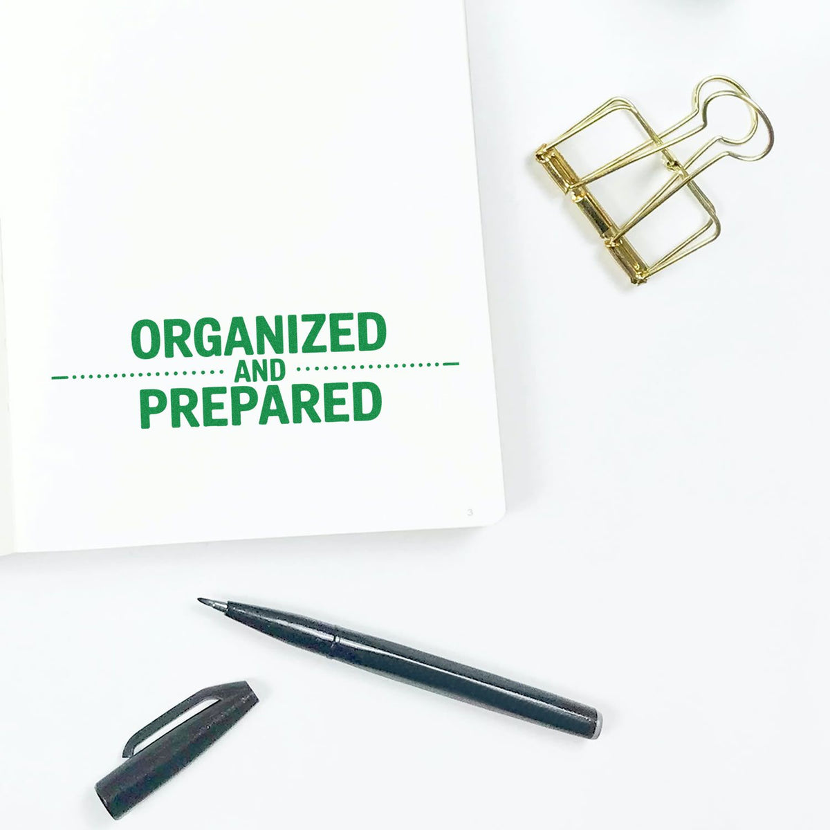 Organized and Prepared rubber stamp on notebook with pen and binder clip, ideal for planners, office organization, and journaling.