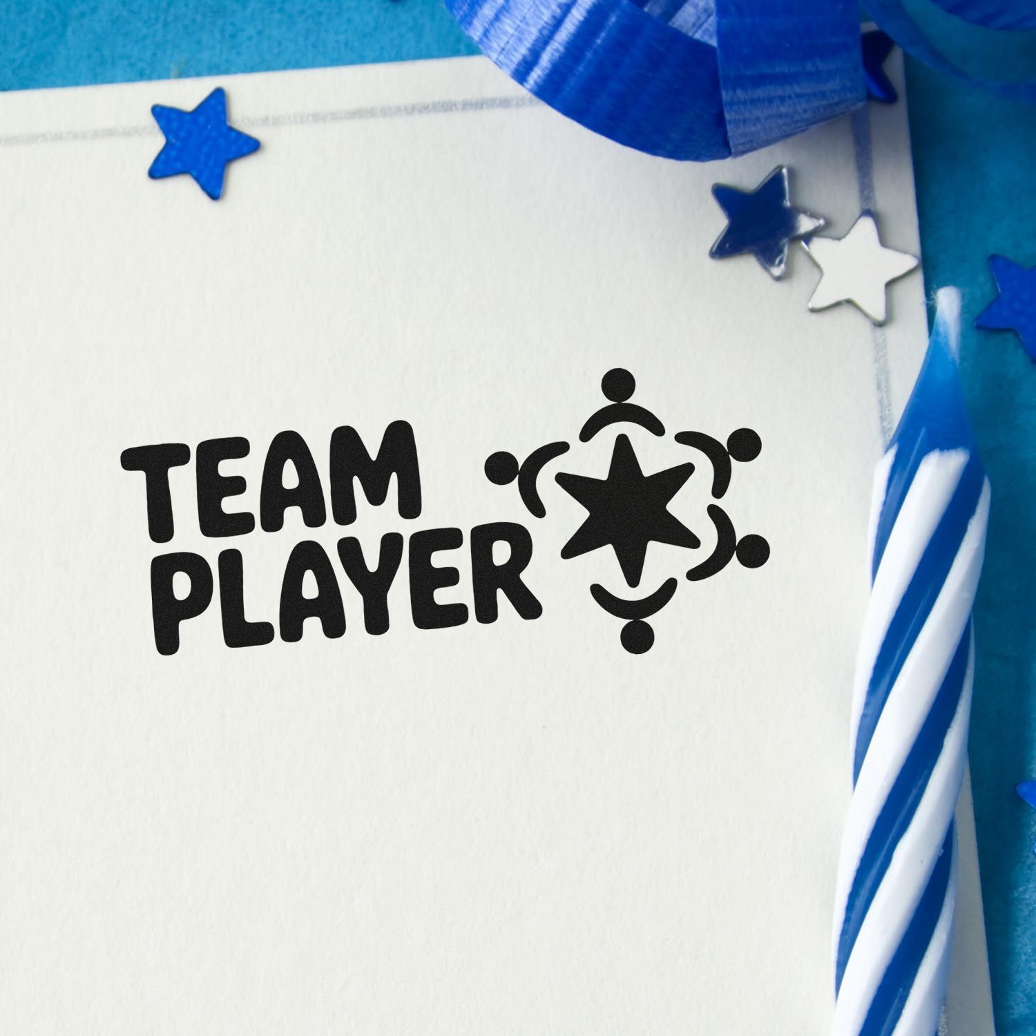 Team player rubber stamp impression on card with stars and blue ribbon for employee recognition and team appreciation.