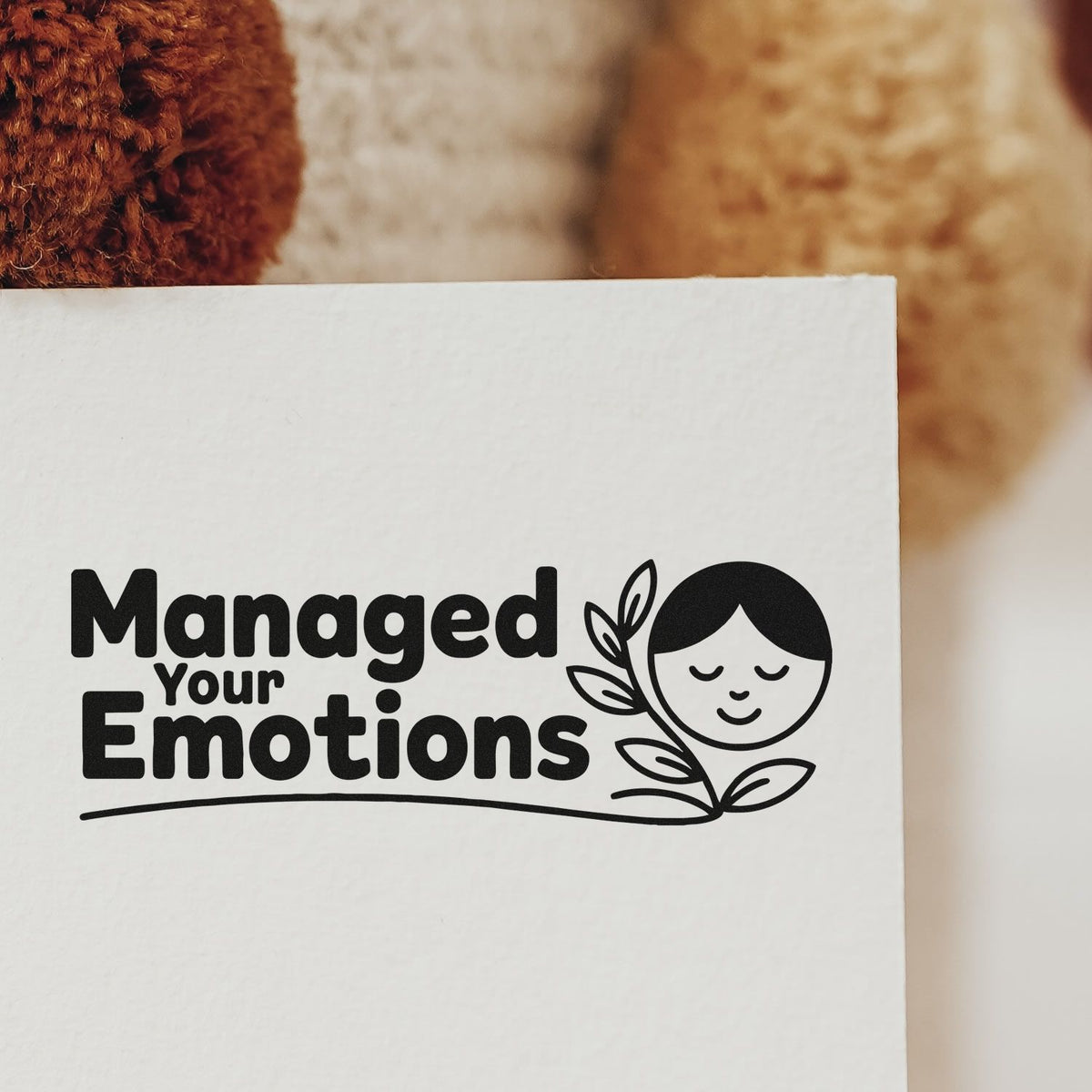 Custom rubber stamp design reading Managed Your Emotions with calming face and leaves, ideal for mindfulness and self-care branding.