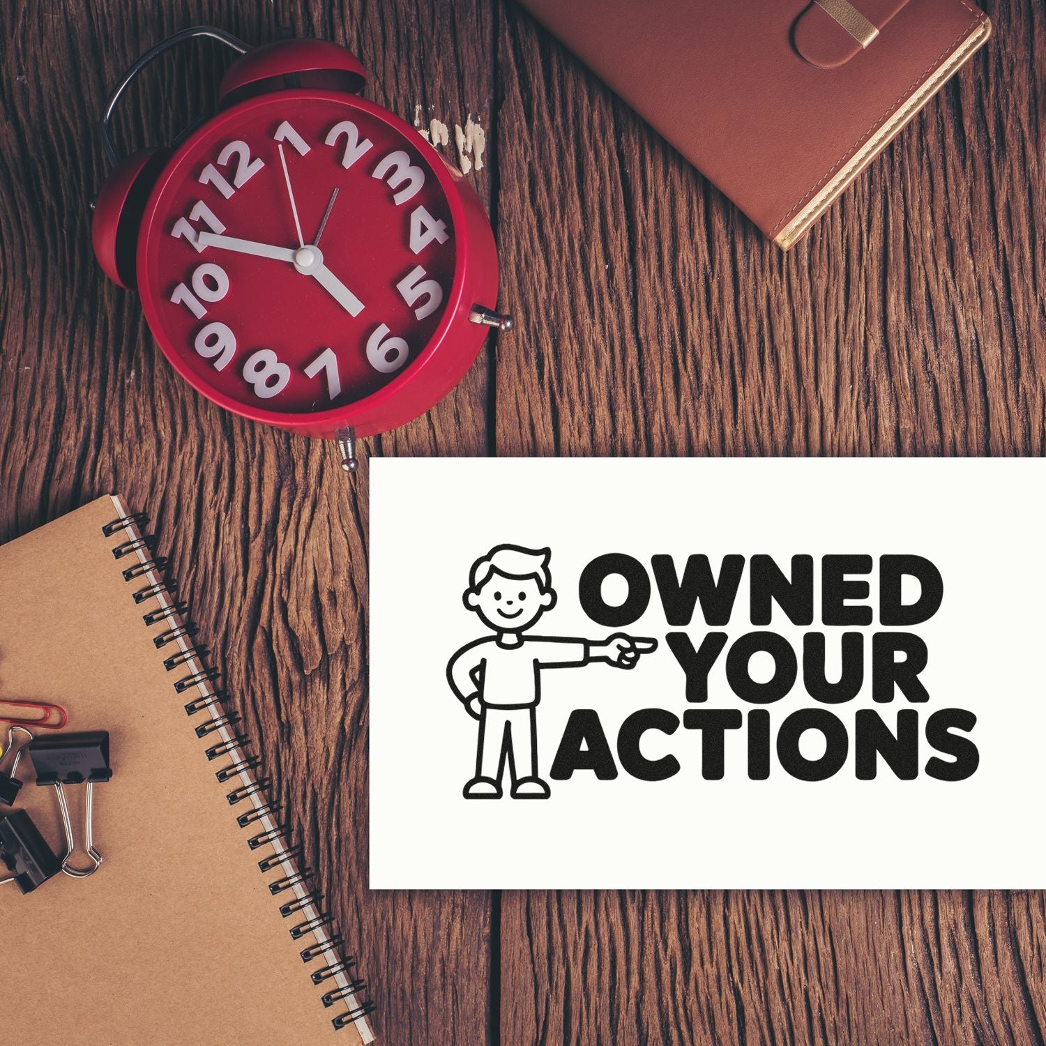 Custom accountability rubber stamp with Own Your Actions message, ideal for office motivation and personal responsibility.