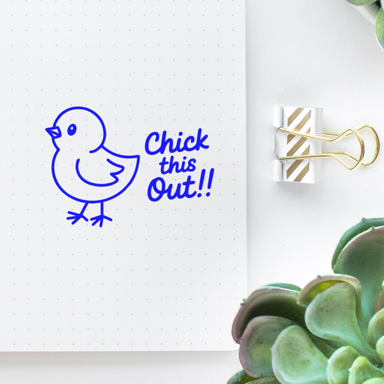 Chick this Out rubber stamp impression on a dotted notebook page, featuring a playful bird design for planners and craft projects.