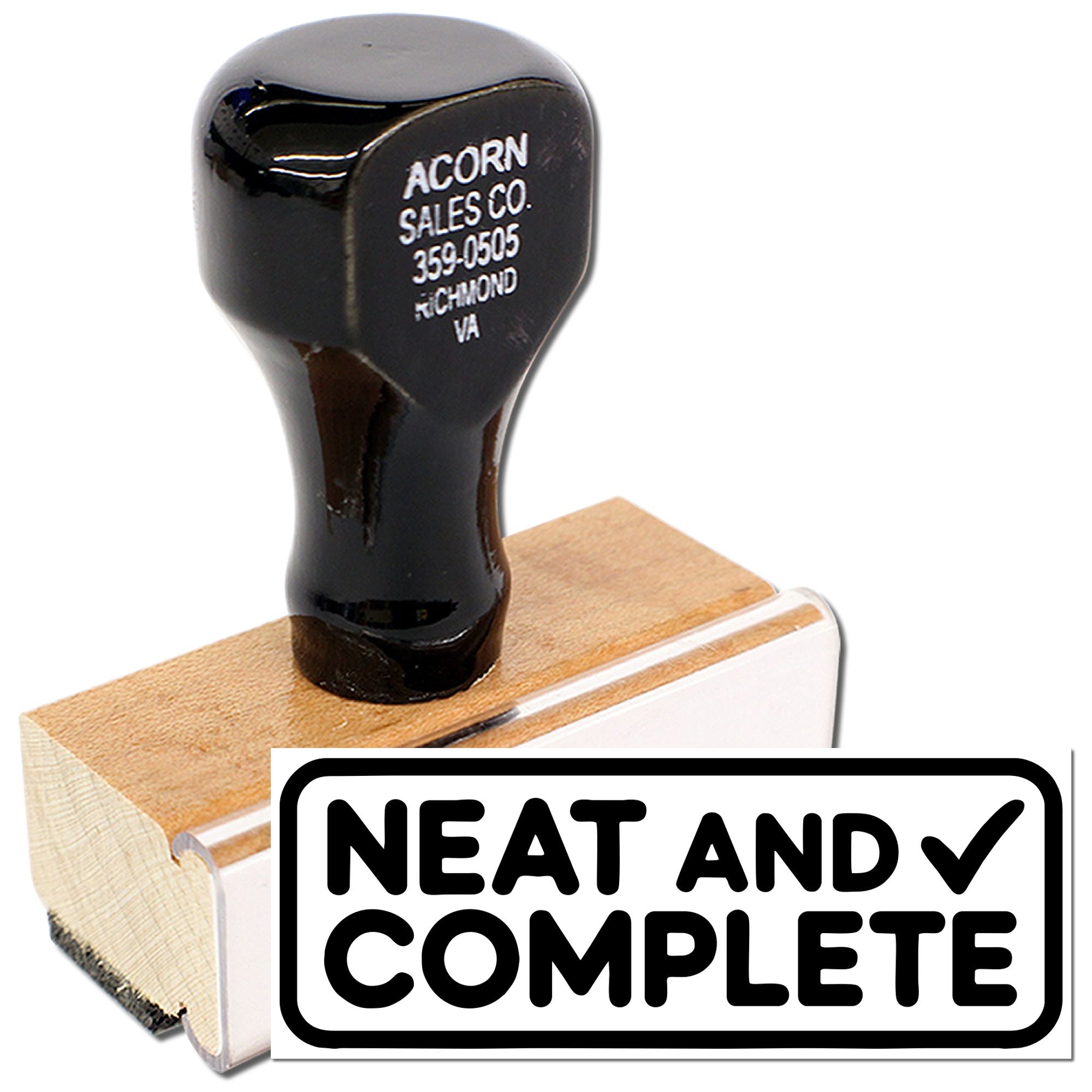 Custom wood-mounted rubber stamp with business address imprint and Neat and Complete design for office use.