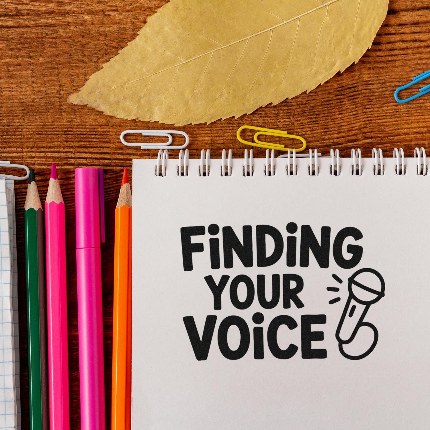 Finding Your Voice rubber stamp design with microphone icon on notebook, ideal for teacher and classroom stationery.