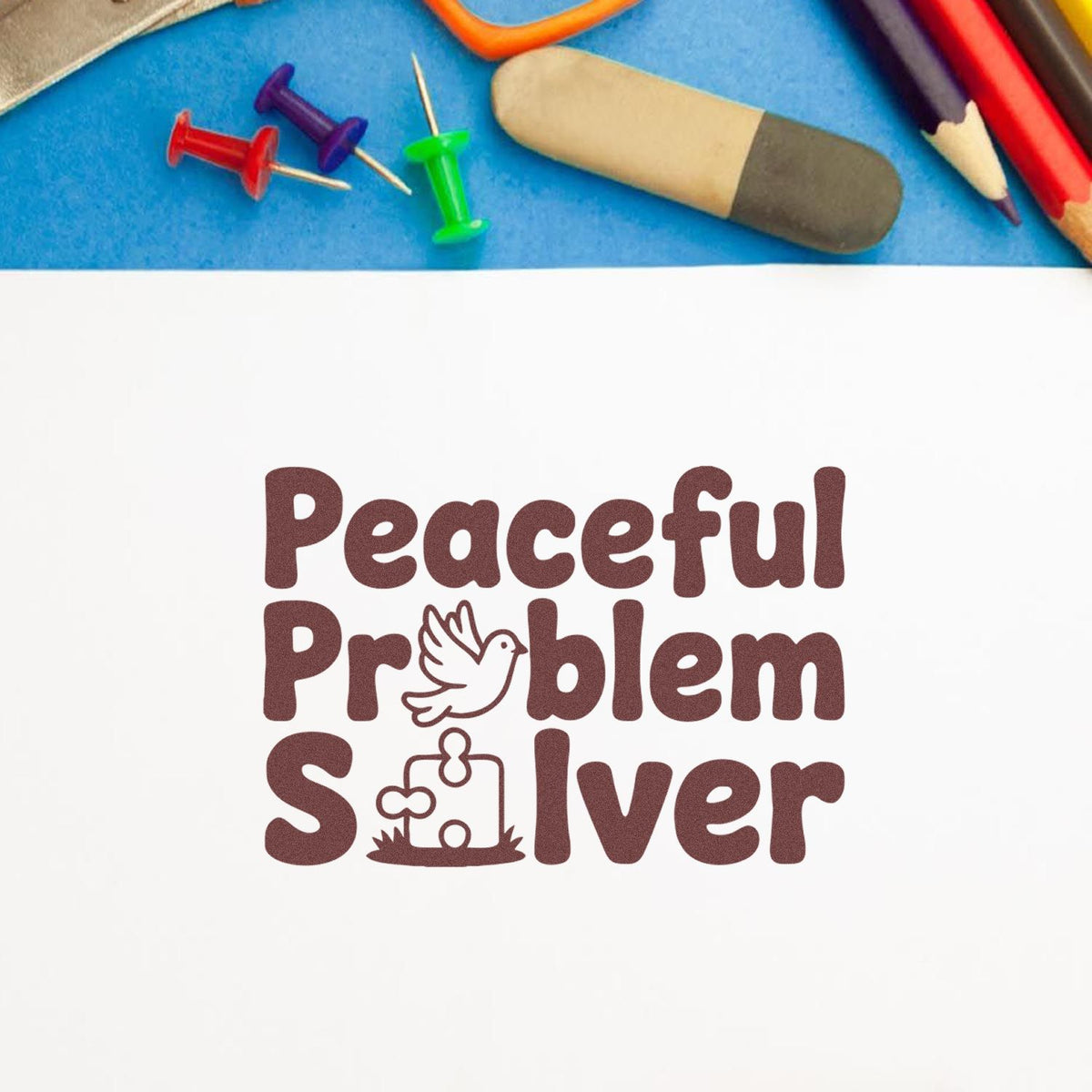 Peaceful Problem Solver rubber stamp design with dove and puzzle icon for classroom behavior and conflict resolution.