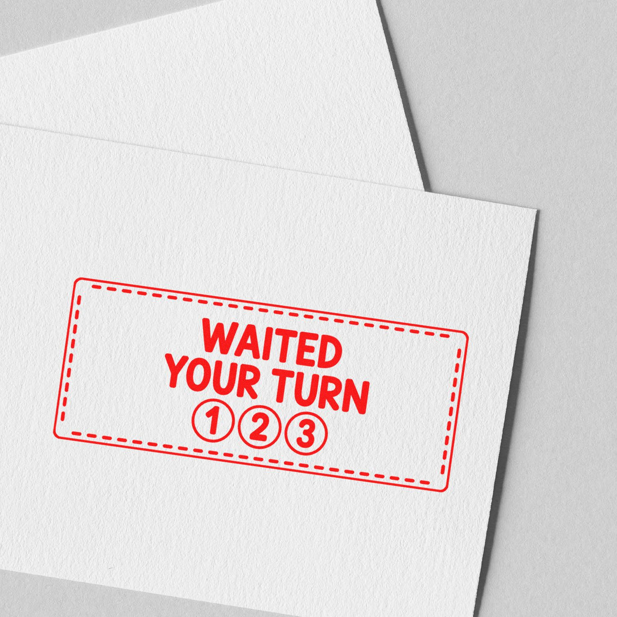 Red rubber stamp design reading Waited Your Turn with numbered circles 1, 2, 3 on paper for custom stationery.
