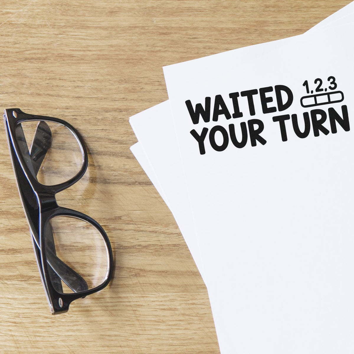 Custom rubber stamp mockup with WANTED YOUR TURN imprint on paper, ideal for office notices and promotional use.