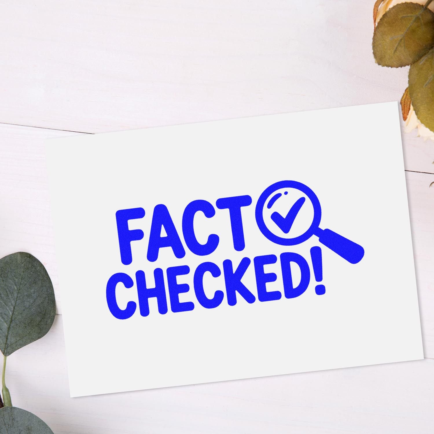 Fact Checked! rubber stamp design with magnifying glass checkmark on white card.