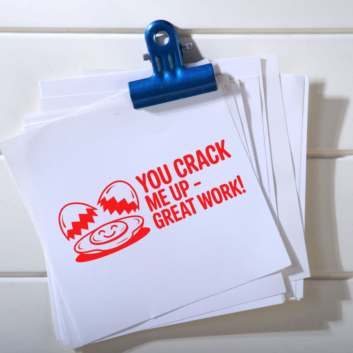 Humorous custom rubber stamp impression reading You crack me up great work! on papers, ideal for teacher and office feedback.