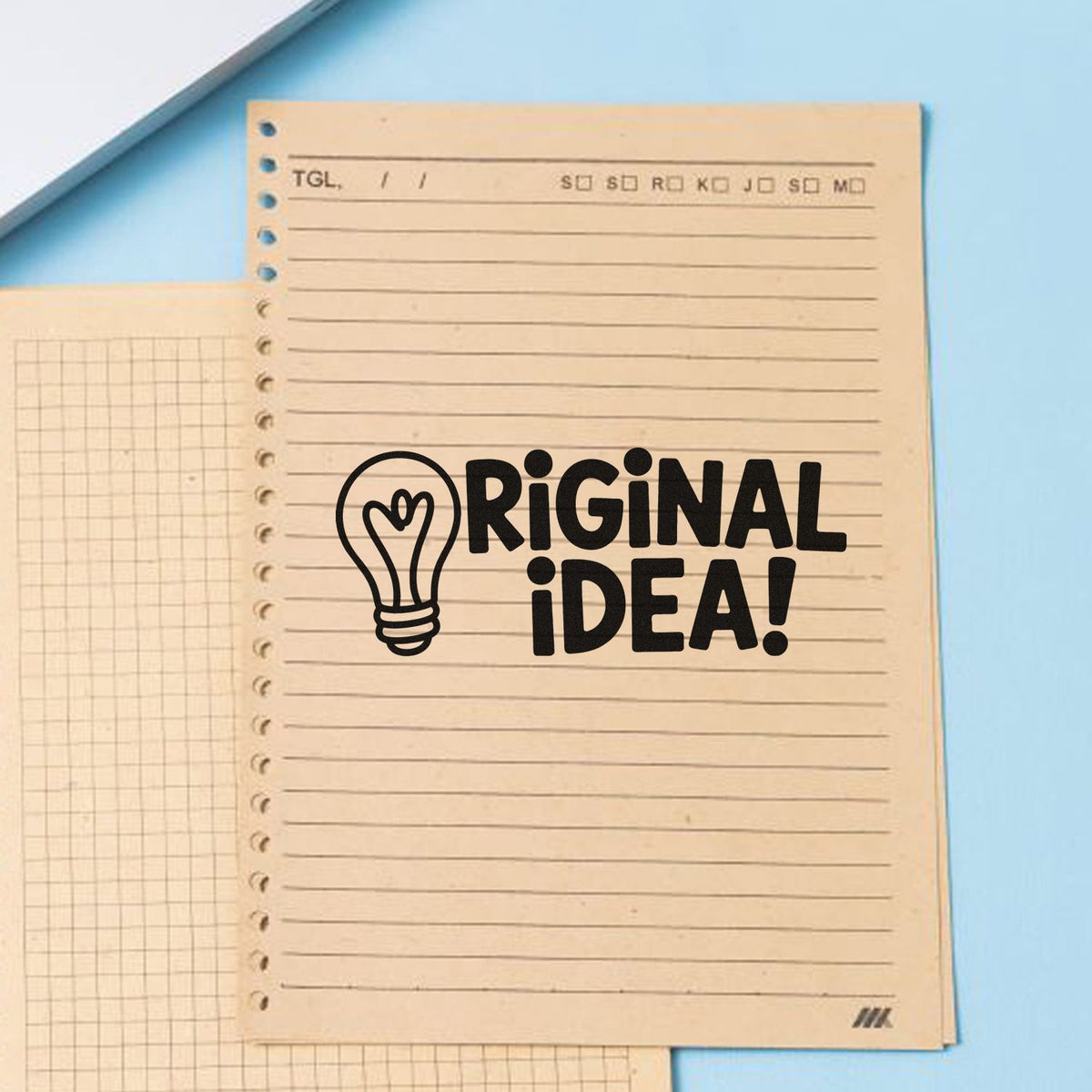 Original Idea! rubber stamp with lightbulb icon on notebook paper, ideal for creative stationery and craft projects