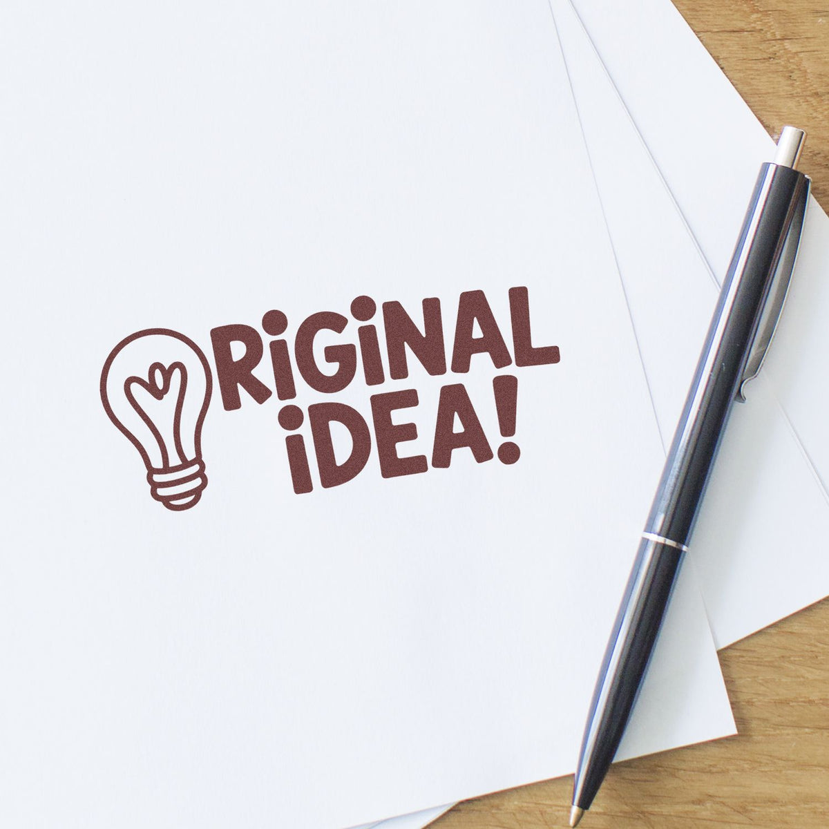 Custom rubber stamp reading Original Idea! with lightbulb icon, ideal for creative projects and office use.
