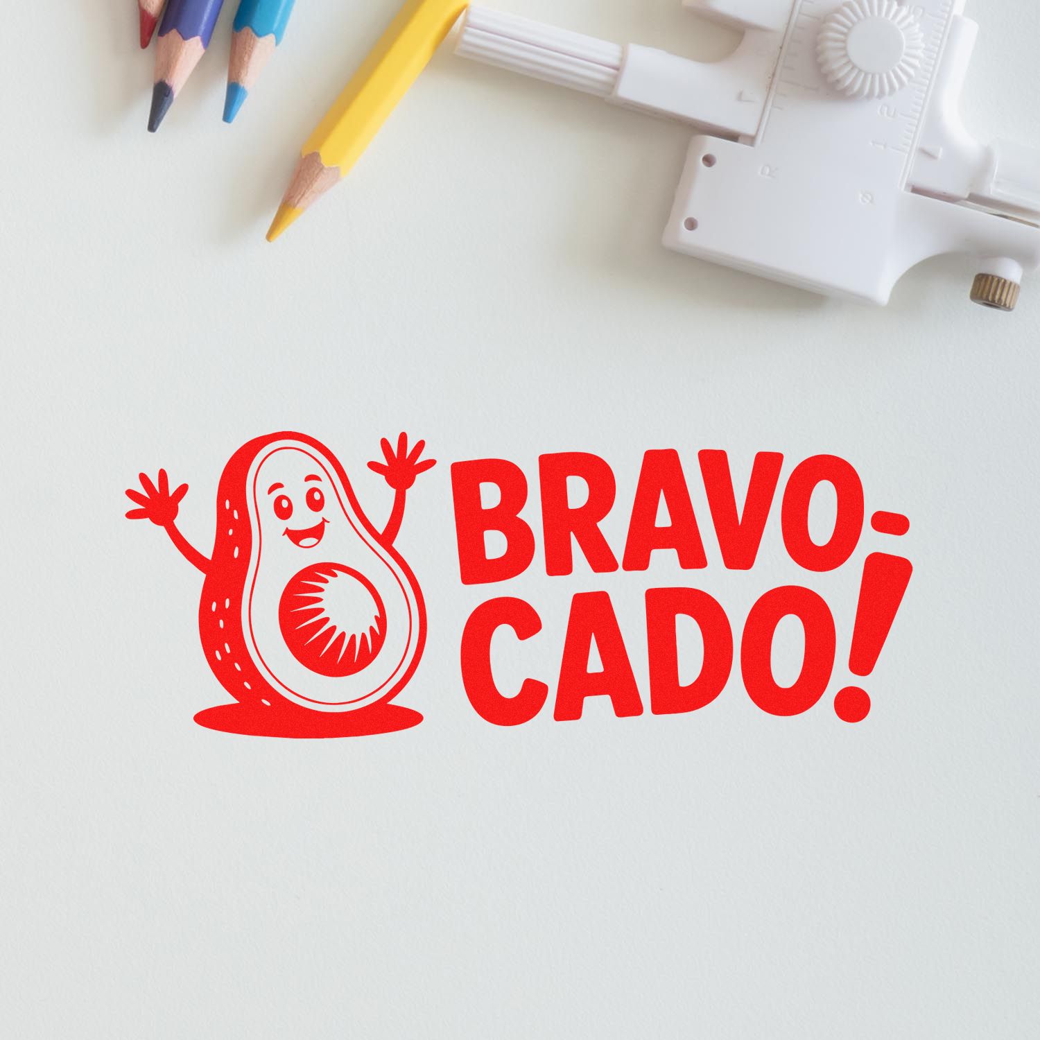 Bravo Cado avocado rubber stamp for teacher rewards and positive classroom feedback, with colored pencils.