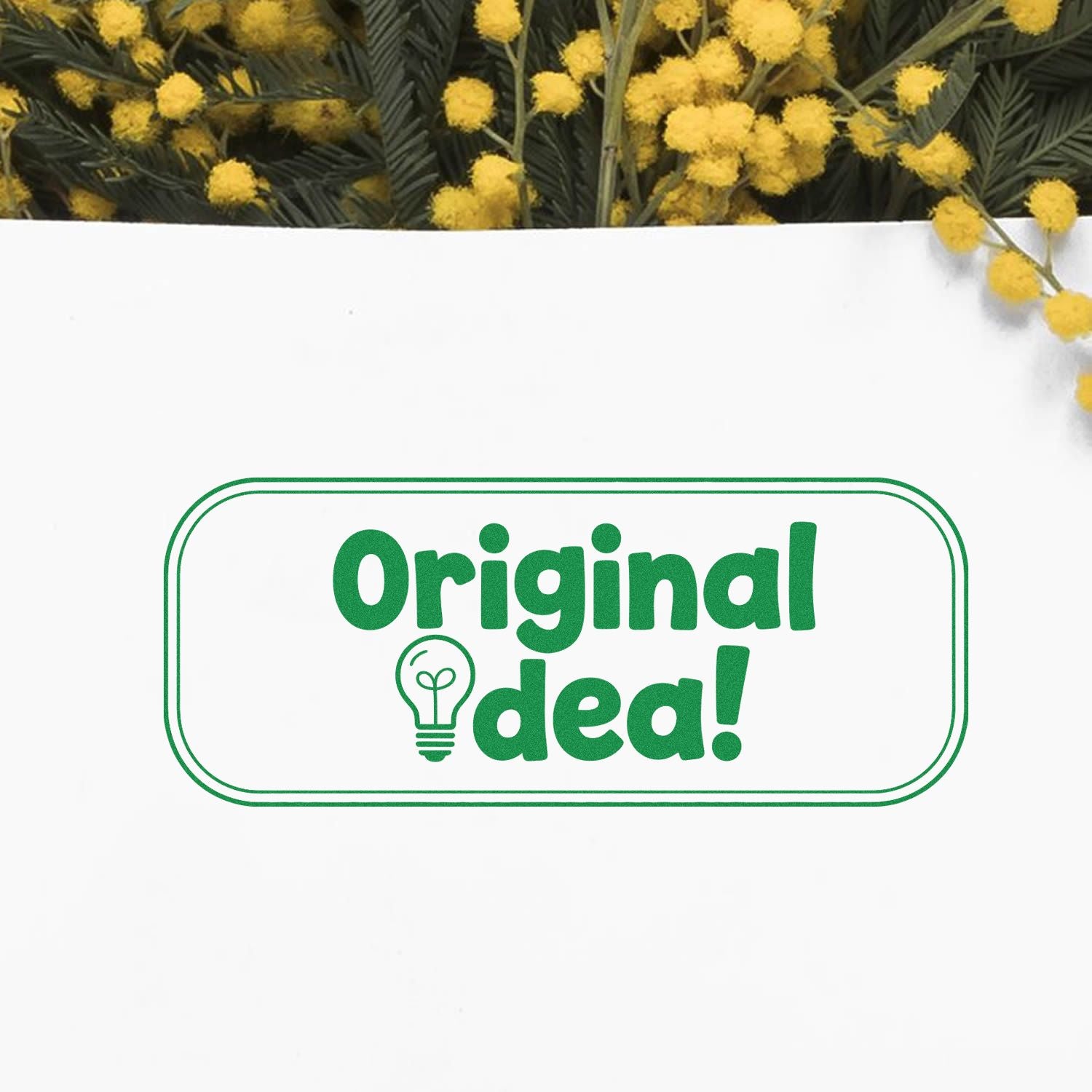 Original idea rubber stamp design in green with lightbulb icon, perfect for creative project branding and packaging.