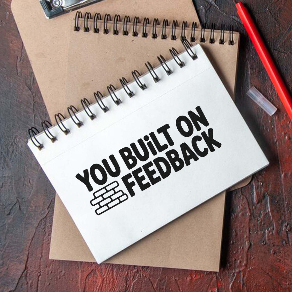 Custom rubber stamp reading You Built on Feedback for office branding, notebooks, and customer feedback.