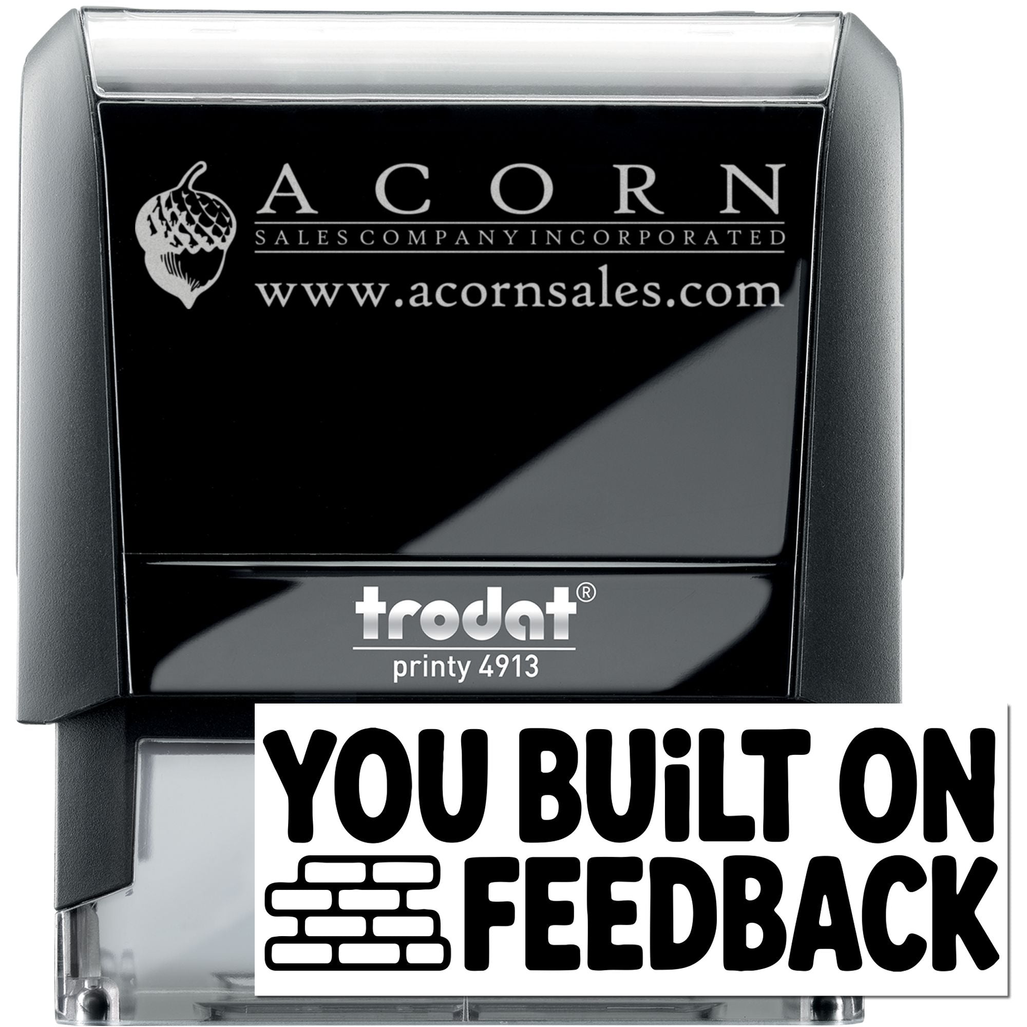 Custom self-inking Trodat rubber stamp for Acorn Sales Company with logo, website, and You Built on Feedback imprint.