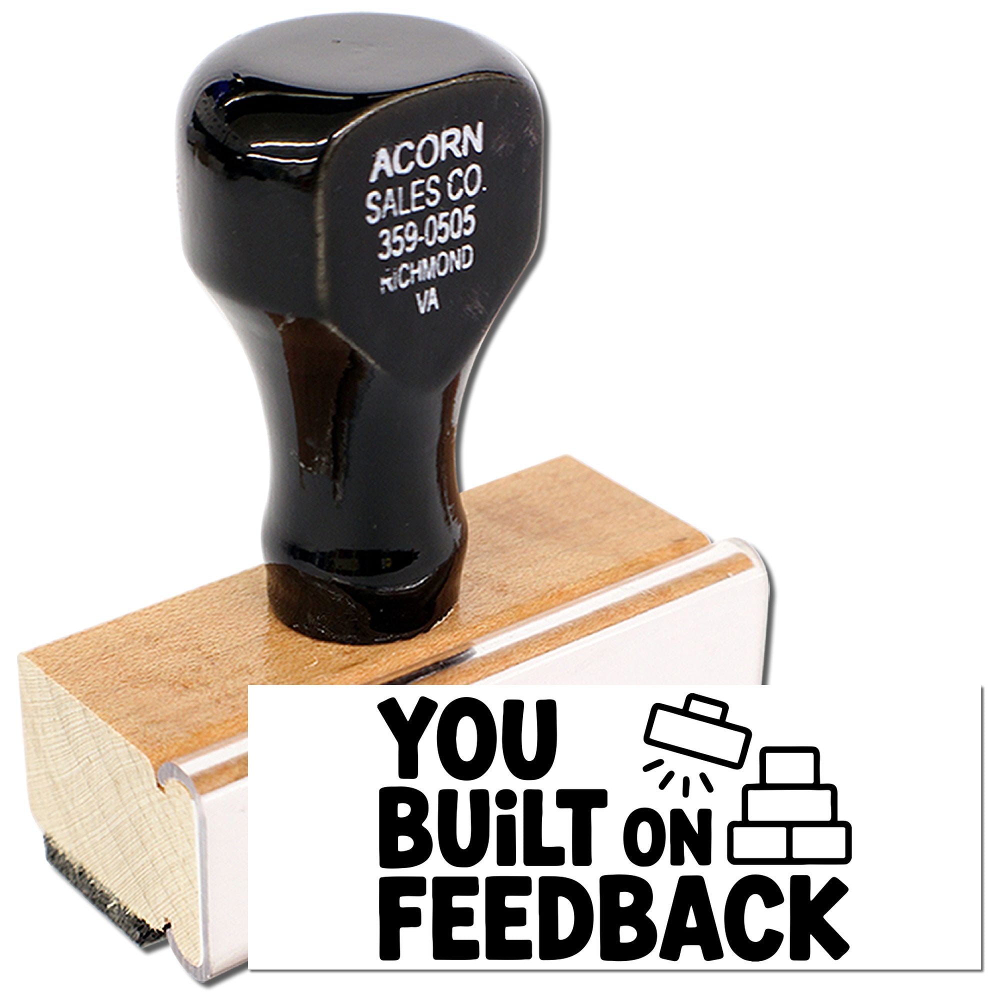Custom rubber stamp featuring You Built on Feedback design on a wooden handle for business recognition.