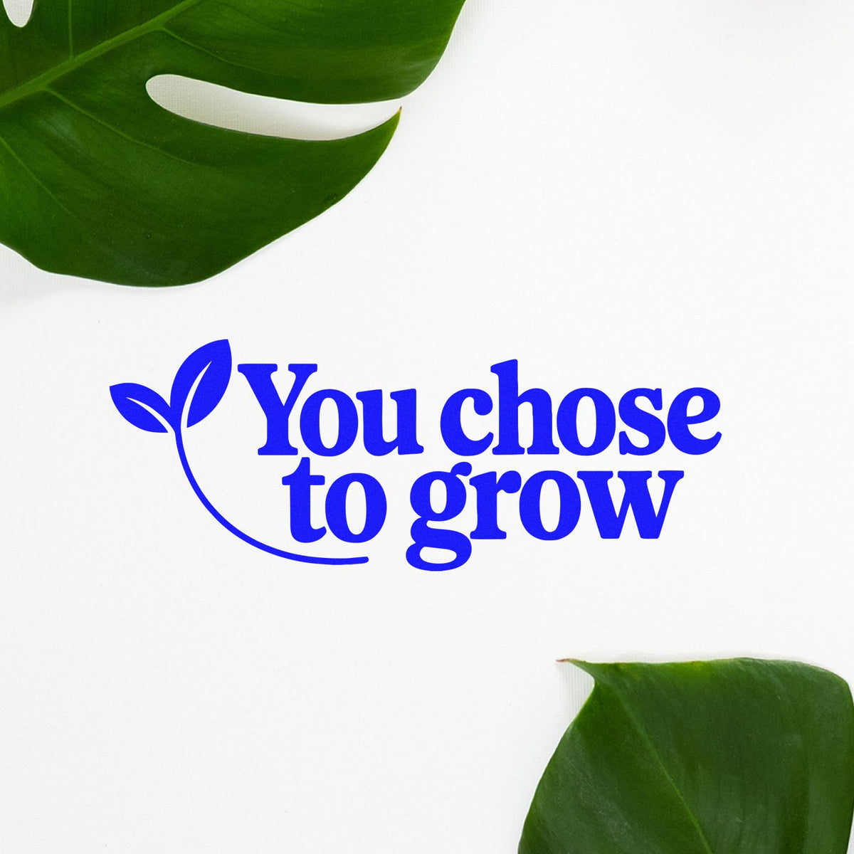 Eco-friendly rubber stamp design reading You chose to grow with leaf icon and green tropical leaves.