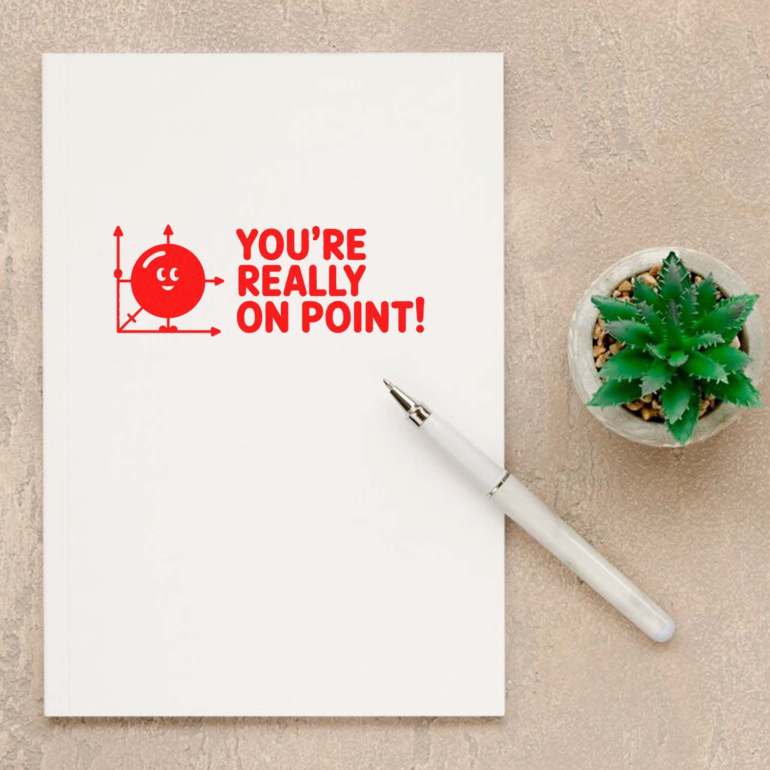 Geometry-themed rubber stamp saying Youre really on point! on a notebook, ideal for teachers and office notes.
