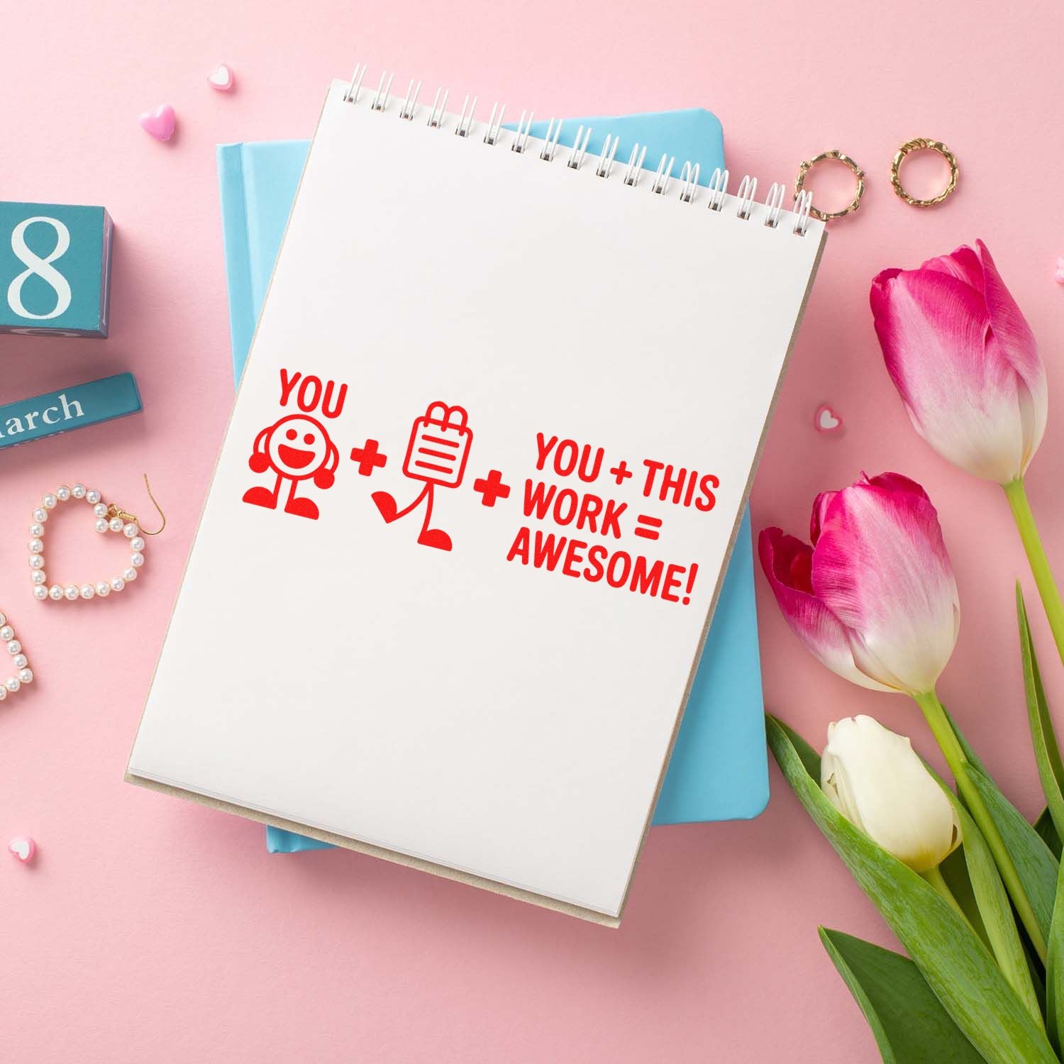 Motivational rubber stamp saying You + This Work = Awesome! on a notebook, ideal for teacher and office supplies.