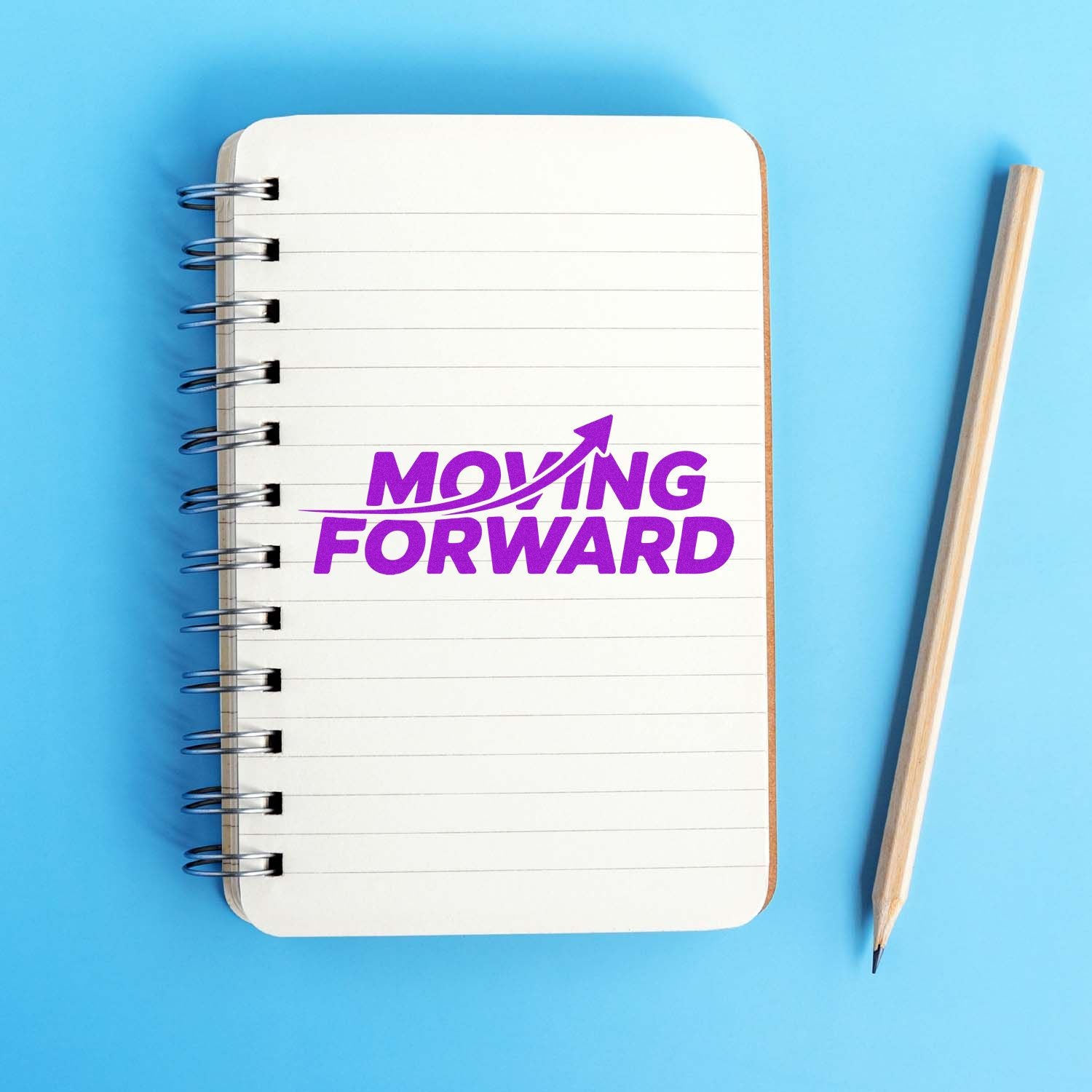 Moving Forward rubber stamp imprint on notebook, symbolizing progress, motivation, and business growth.