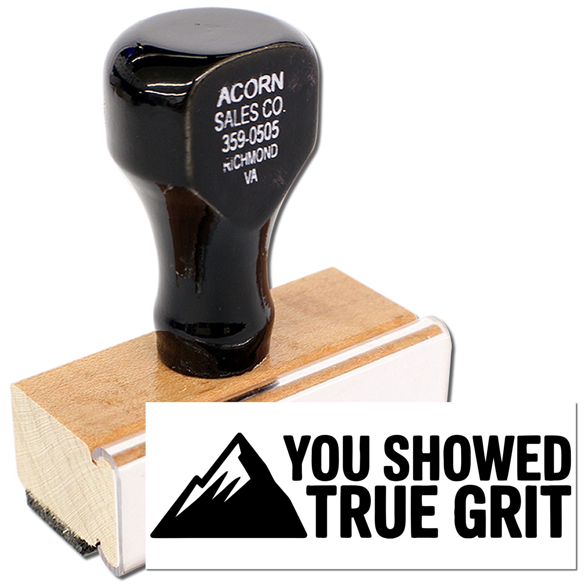 Custom rubber stamp with You Showed True Grit message and mountain icon on wooden mount.