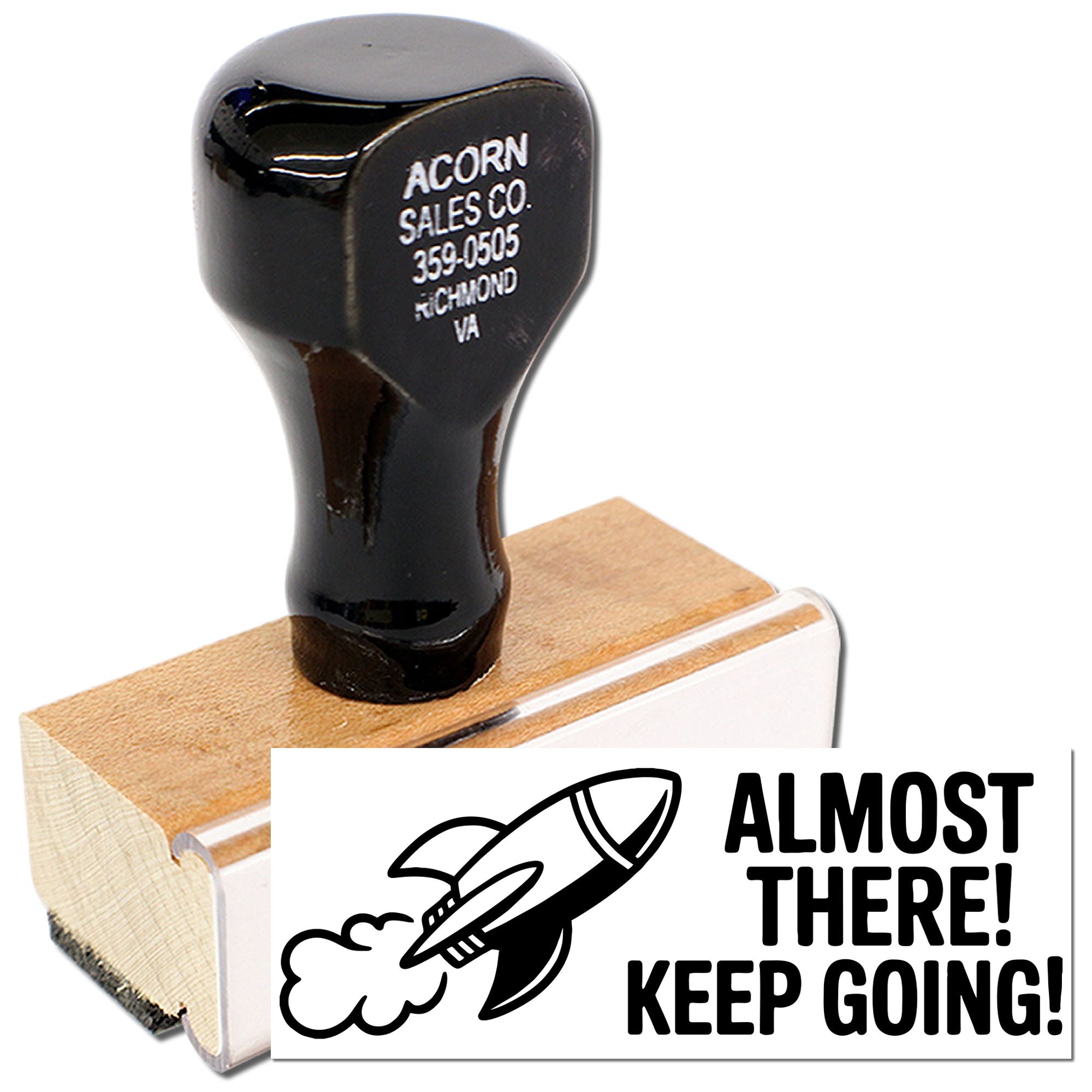 Custom rubber stamp with rocket and Almost There! Keep Going! motivational phrase for business encouragement.