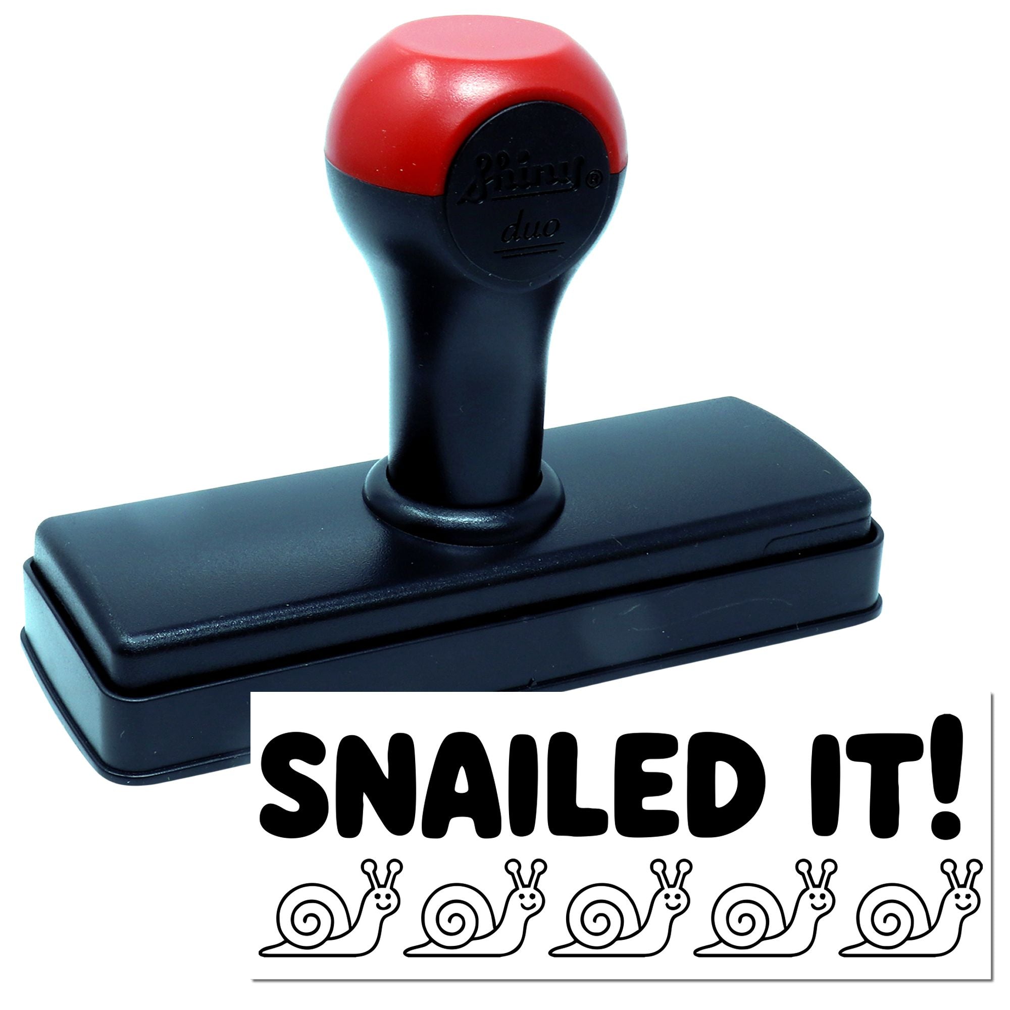 Self-inking rubber stamp reading Snail It! with snail icons, ideal for slow mail, office humor, and custom stationery.