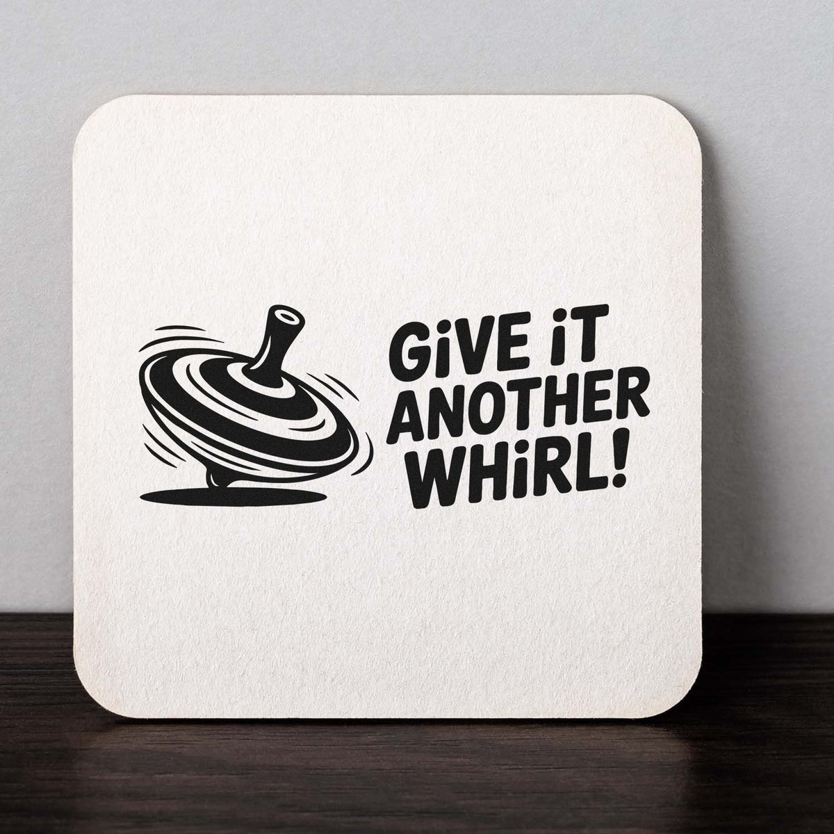 Give It Another Whirl rubber stamp design with spinning top illustration, ideal for playful cards, crafts, and custom stationery.