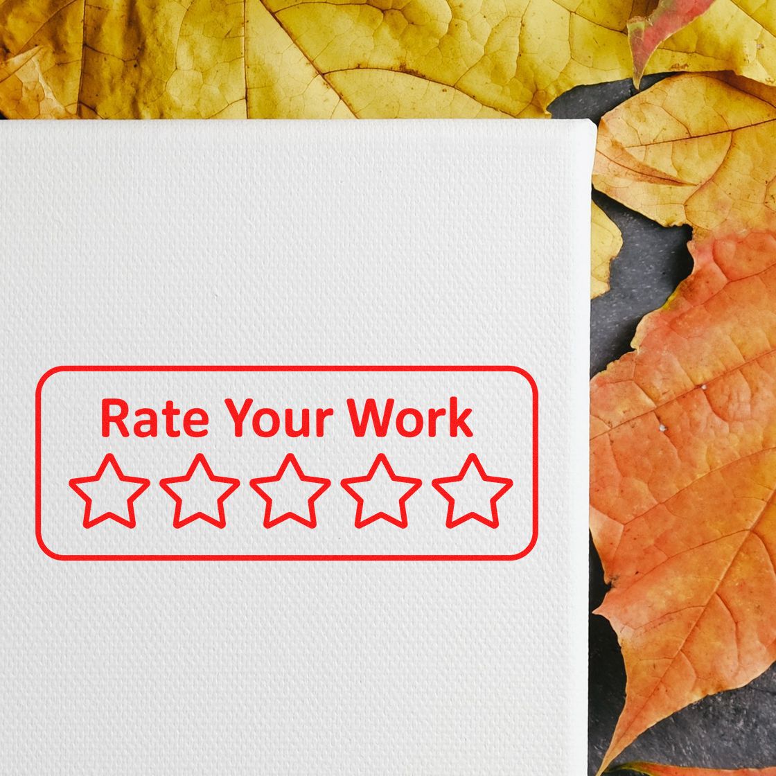 Rubber stamp with Rate Your Work and five stars for employee feedback, review, and performance rating.