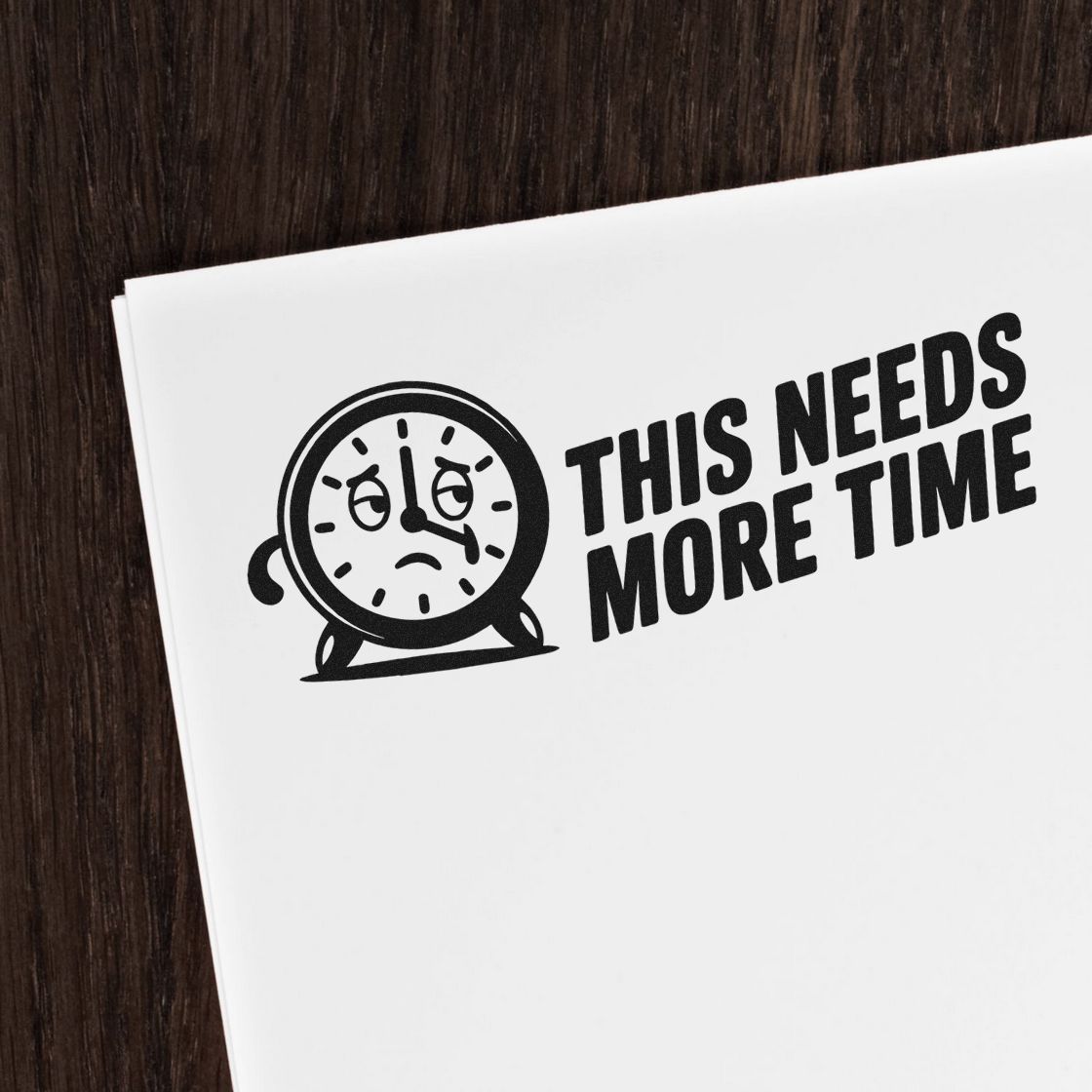 Custom rubber stamp design with clock icon and This Needs More Time text for office feedback and review reminders.