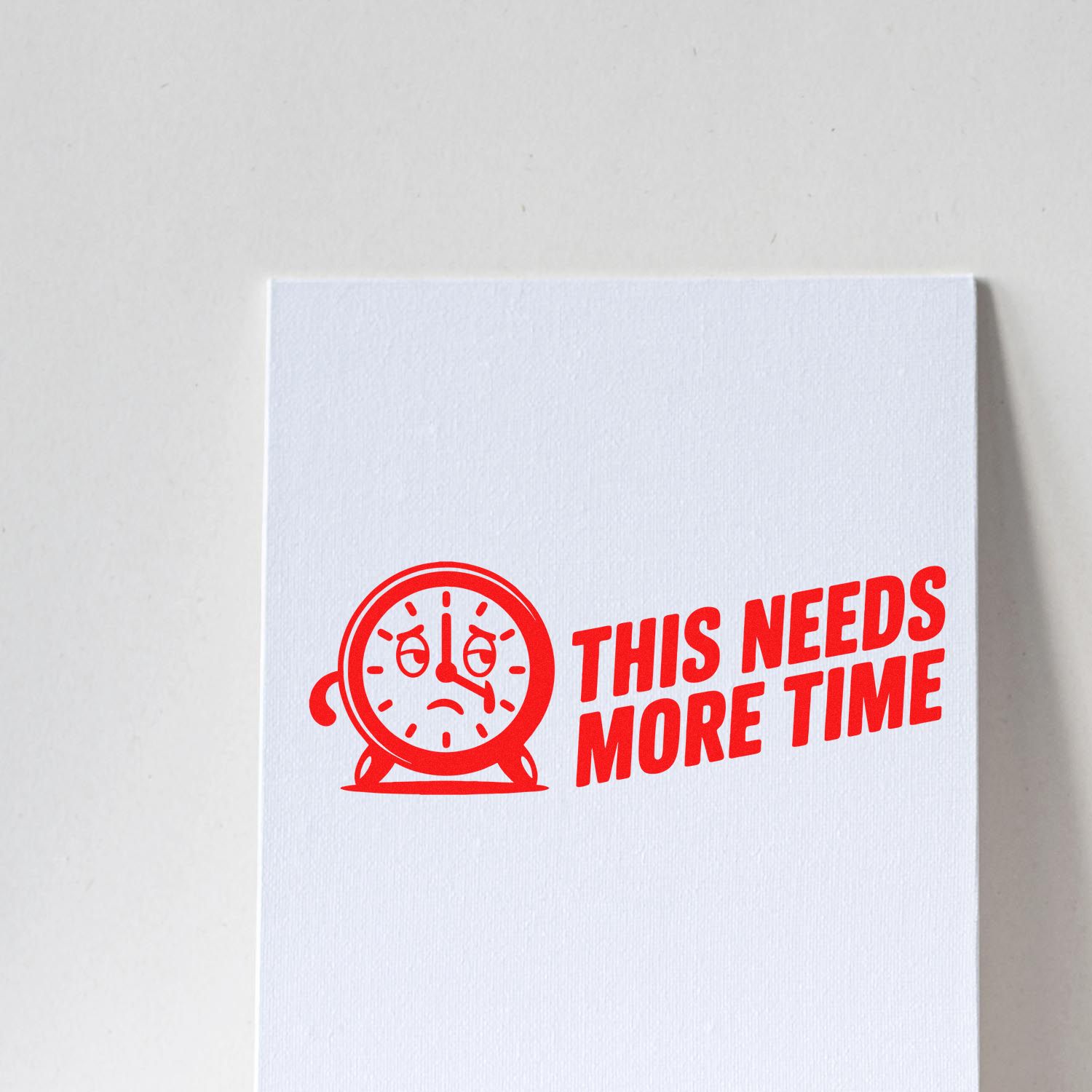 Custom rubber stamp design reading This Needs More Time with a tired clock icon for office reminders and project delays.