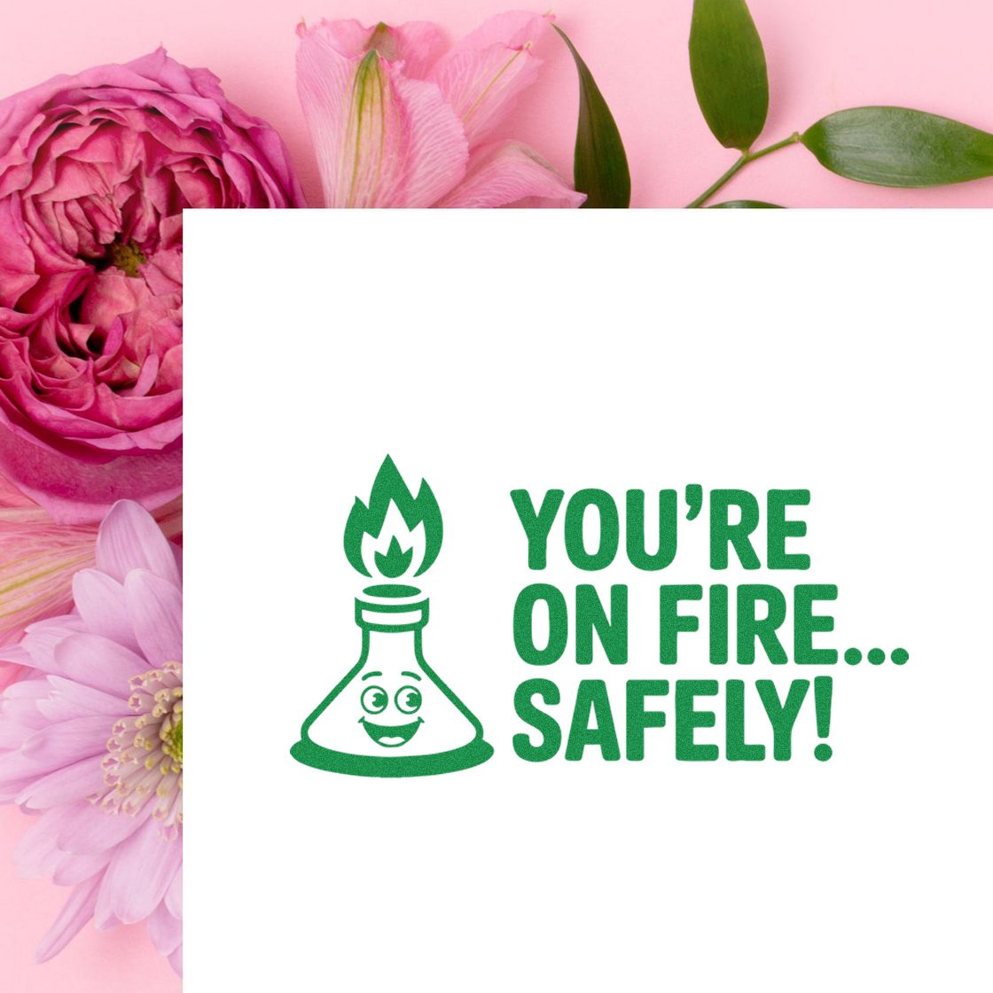 Rubber stamp design reading Youre on fire safely! with smiling flame flask, ideal for fun teacher or office recognition.