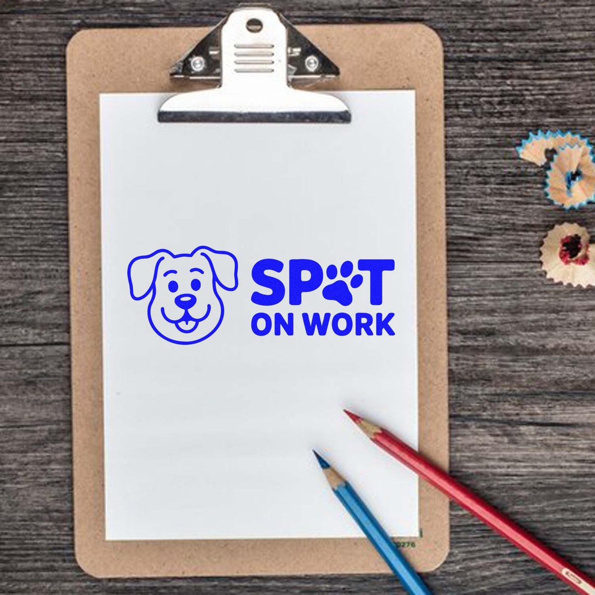 Custom rubber stamp impression with dog logo and Spot On Work branding on clipboard paper.