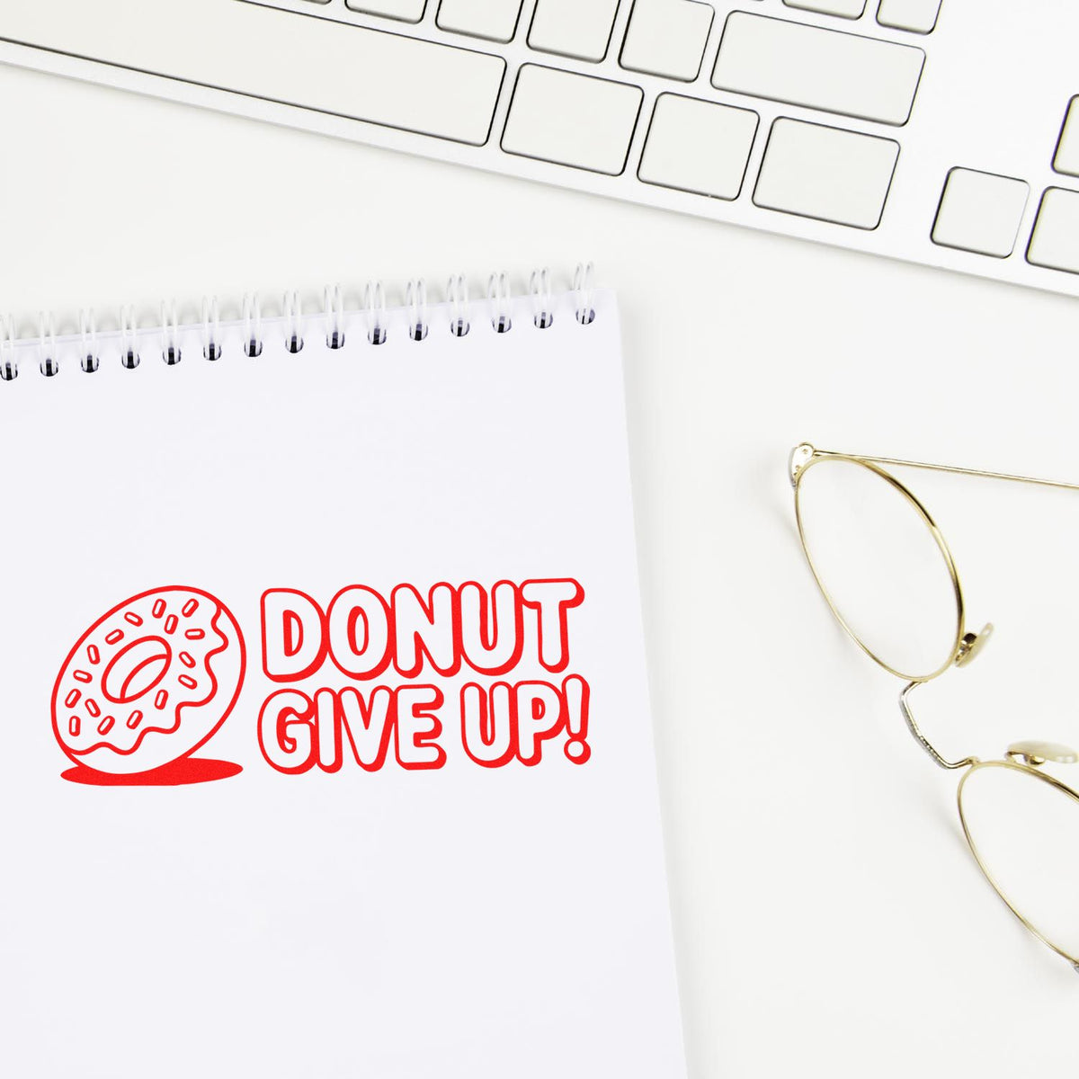 Donut Give Up! donut-themed rubber stamp for motivational stationery, bakery packaging, and fun office branding.