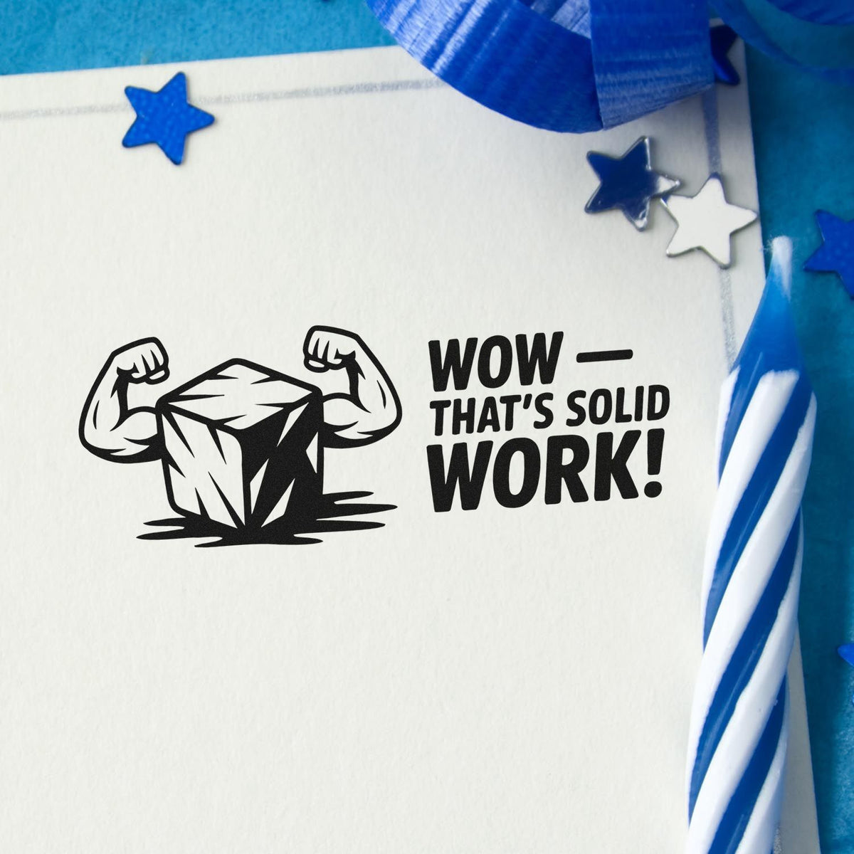 Rubber stamp impression with flexing rock and WowThats Solid Work! message on paper, surrounded by blue stars.