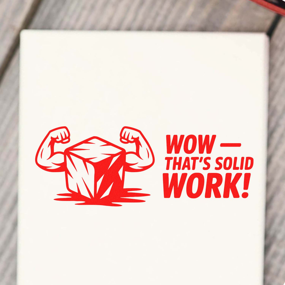 Custom rubber stamp design with flexing rock graphic and Wow Thats Solid Work! message for construction and handyman praise.