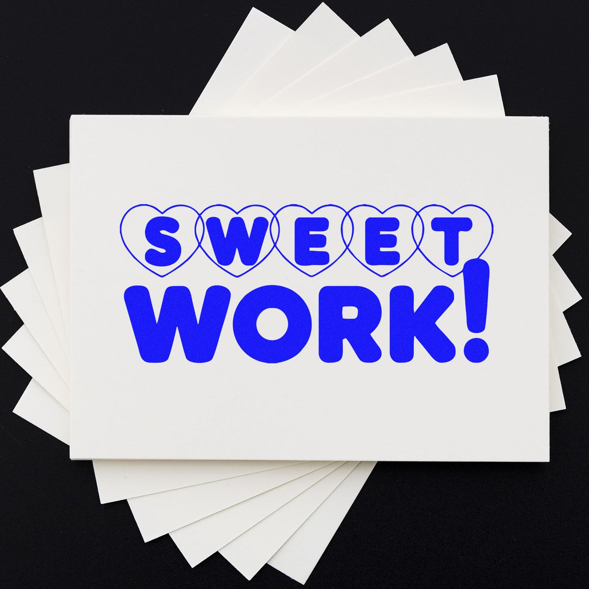 Blue Sweet Work rubber stamp design on stacked white cards, perfect for custom motivational or office stamps.