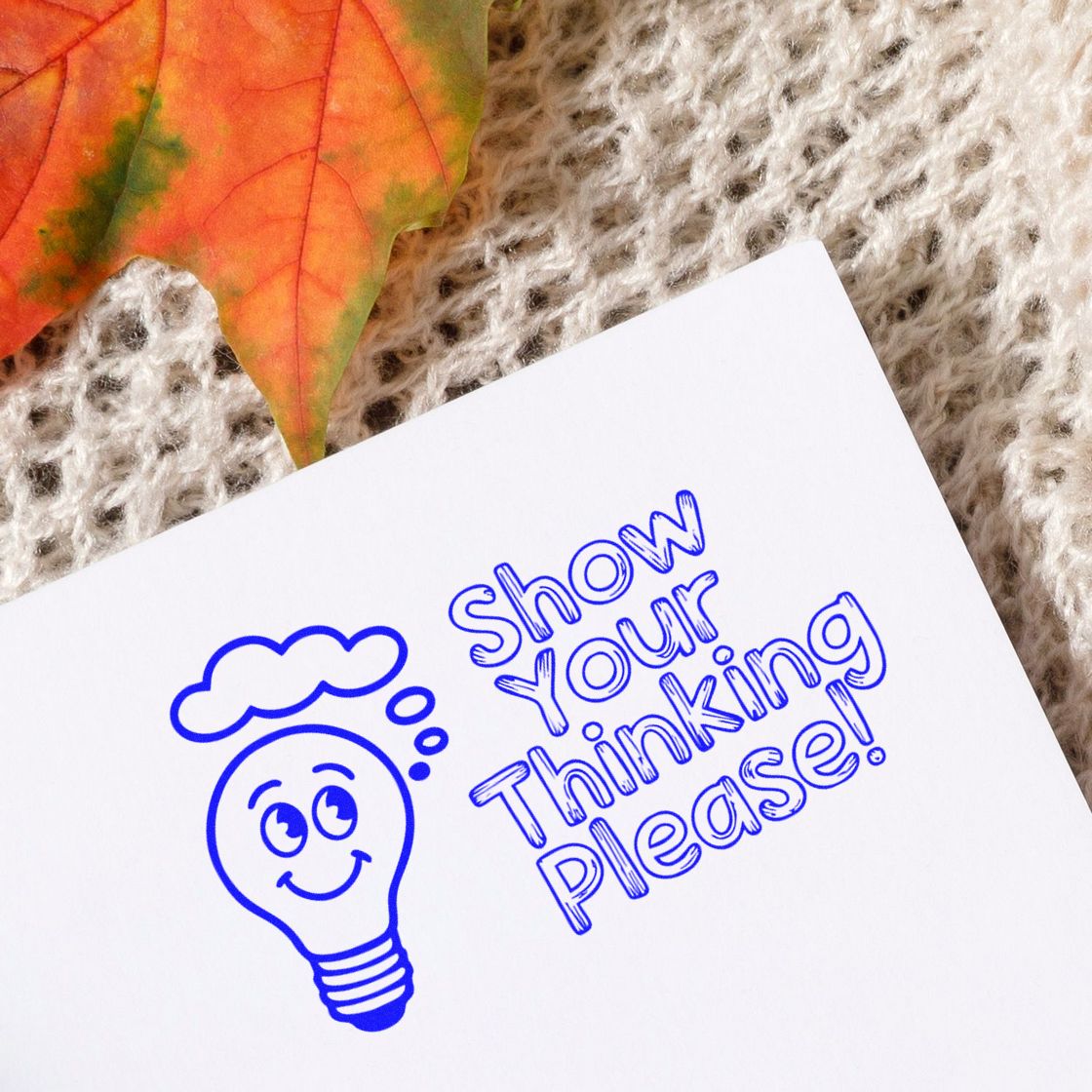 Rubber stamp design with smiling lightbulb and Show Your Thinking Please! for classroom or office feedback.