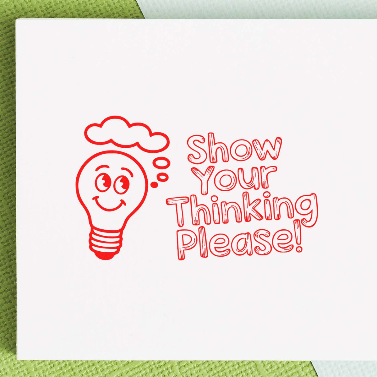 Show Your Thinking Please rubber stamp design with smiling lightbulb, ideal for classroom feedback, teaching and office use.