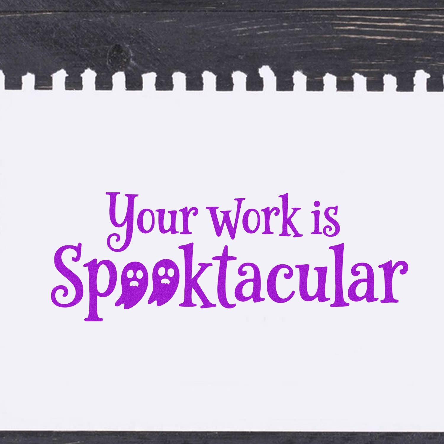 Halloween rubber stamp sentiment reading Your work is Spooktacular in purple on white paper.
