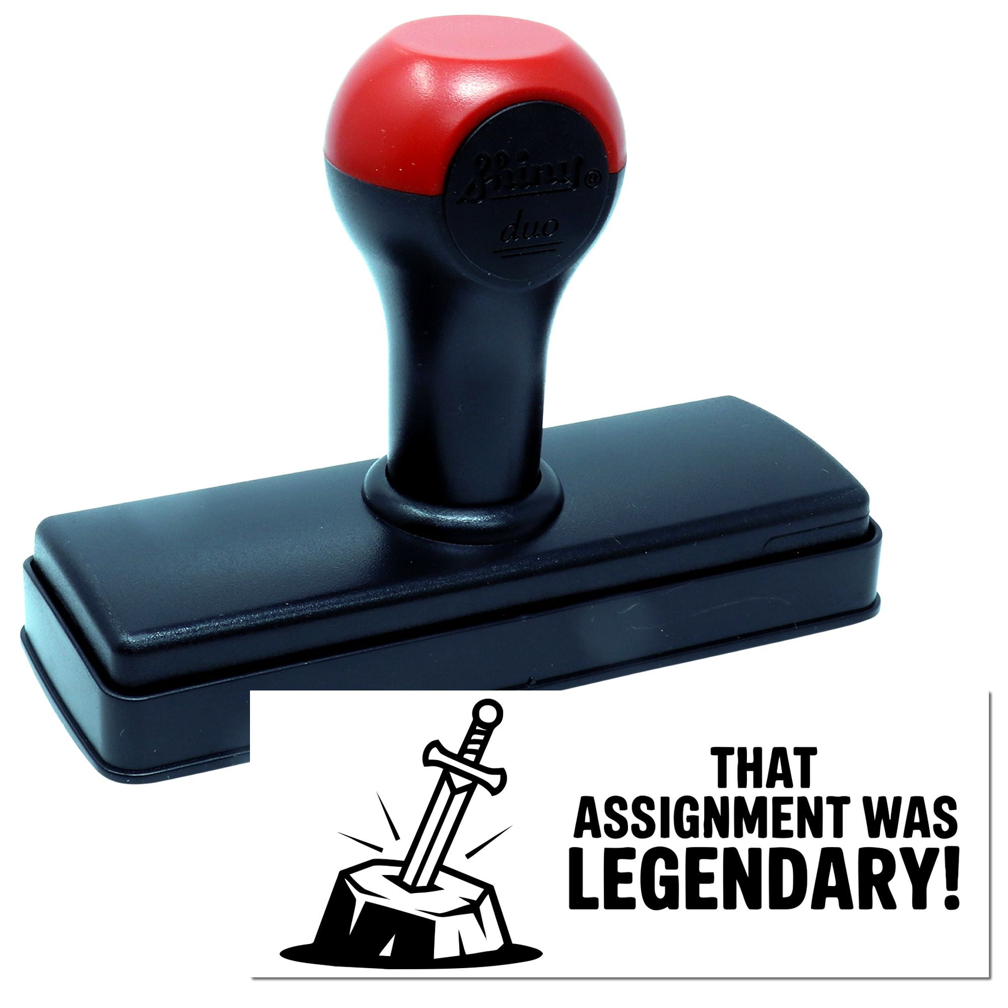 Self-inking rubber stamp with sword design and That assignment was legendary! imprint for teacher grading and student rewards.
