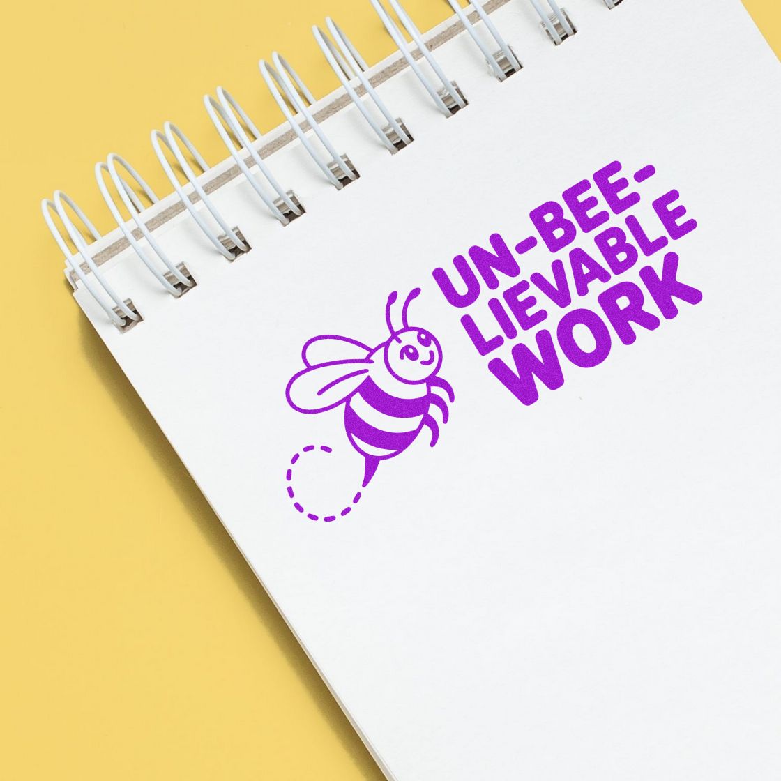 Bee rubber stamp design with UN-BEE-LIEVABLE WORK text, ideal for teacher praise, office use, and craft projects.