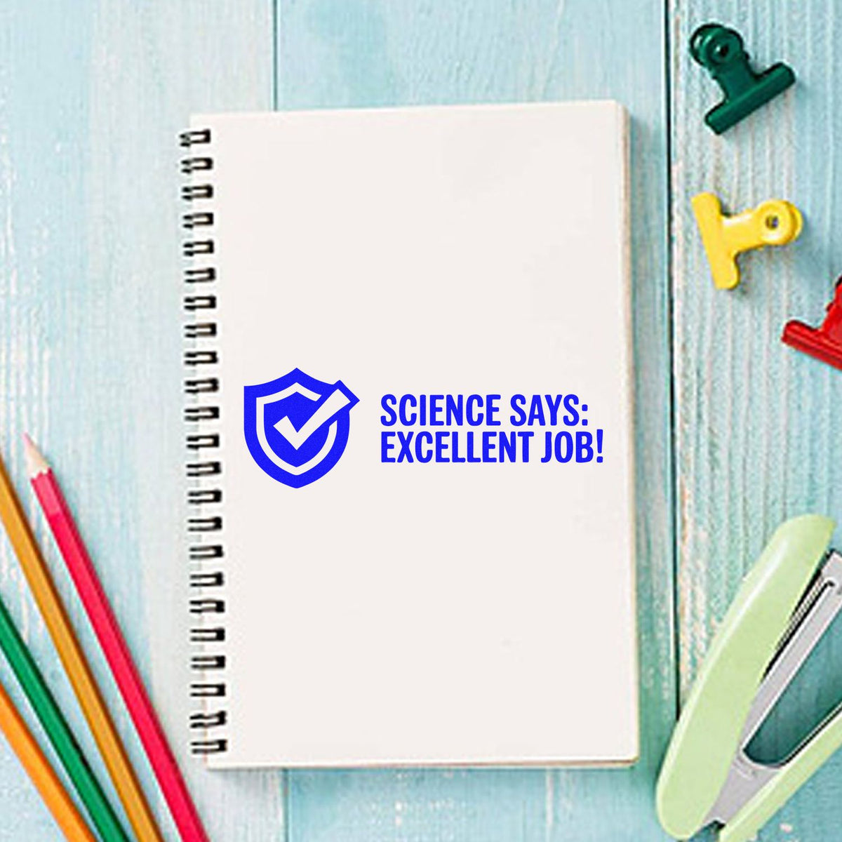 Science says excellent job rubber stamp on notebook, perfect for teacher feedback and student reward stamping.