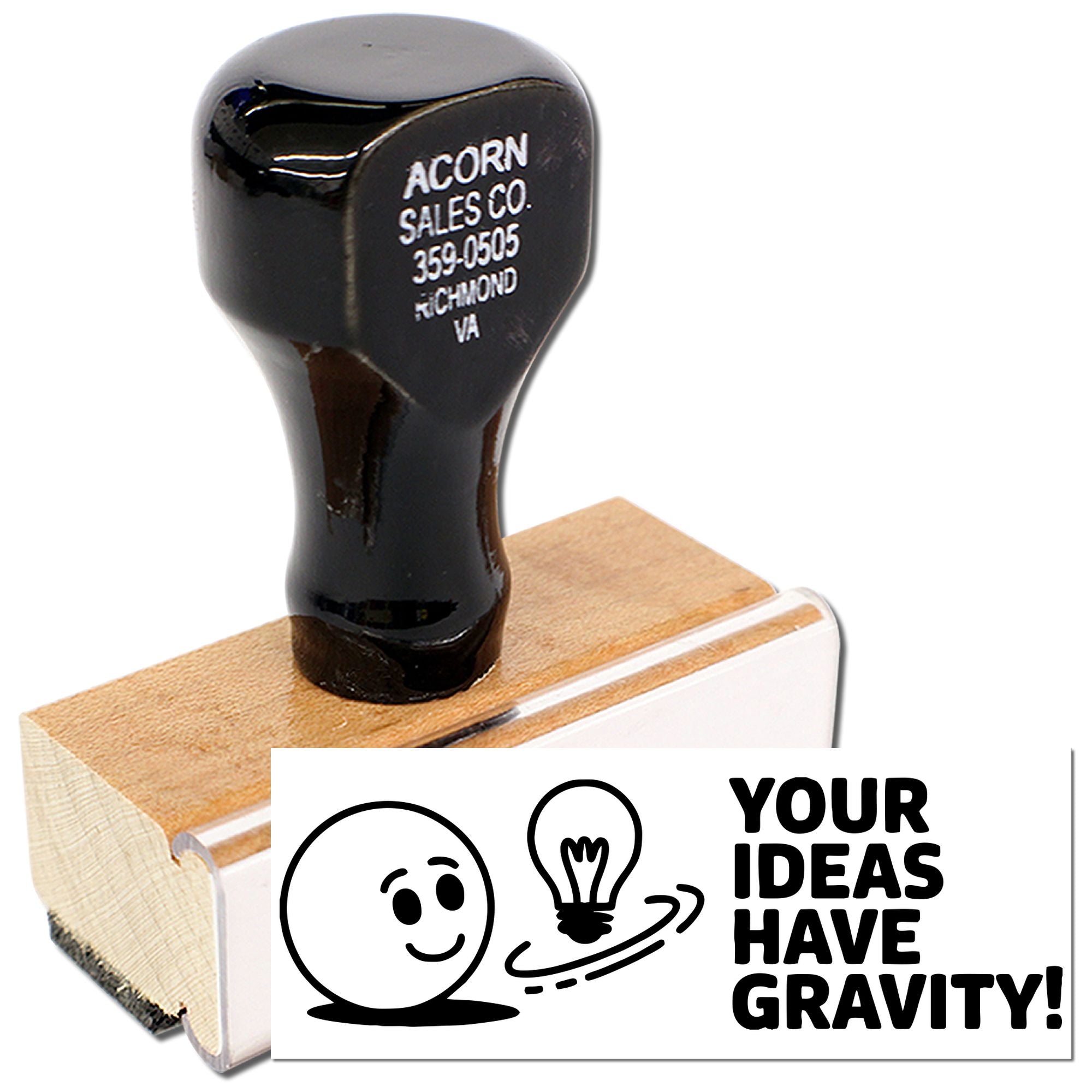 Custom rubber stamp with Your ideas have gravity! design, smiley face, and lightbulb on a wooden stamp block.