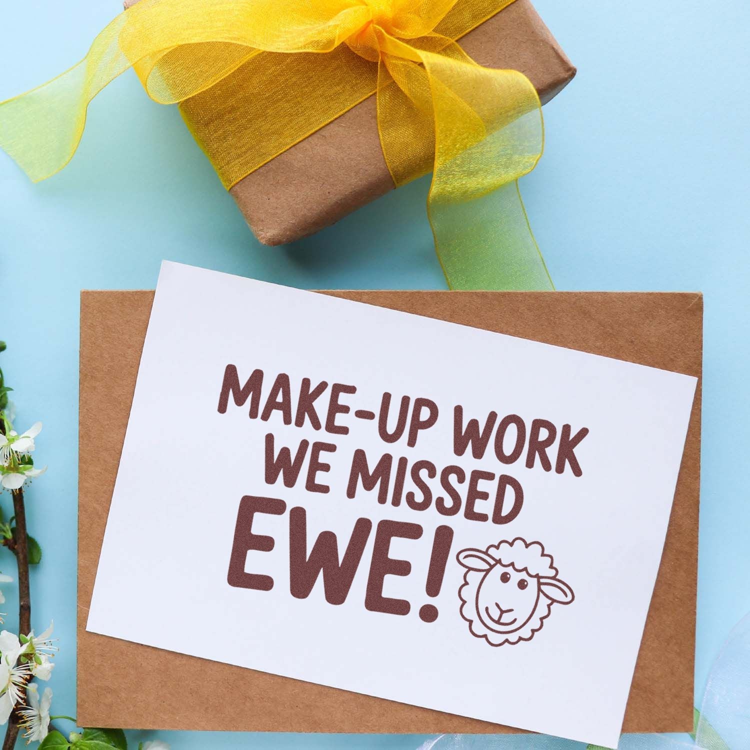 Funny sheep rubber stamp greeting card reading Make-up work we missed ewe! on a wrapped gift, ideal for Easter and classroom use.