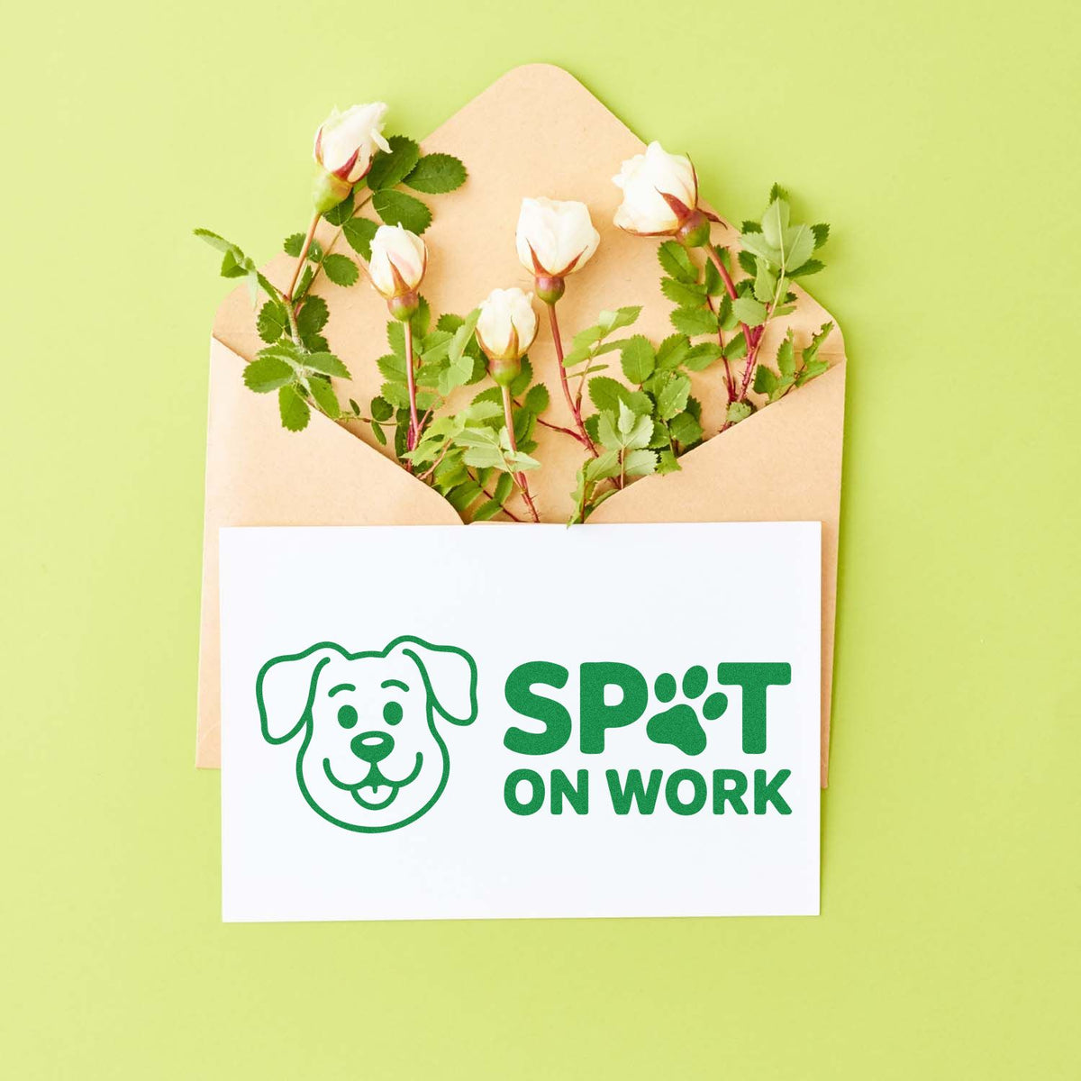 Custom dog-themed rubber stamp mockup reading Spot On Work on a card in an envelope with flowers.