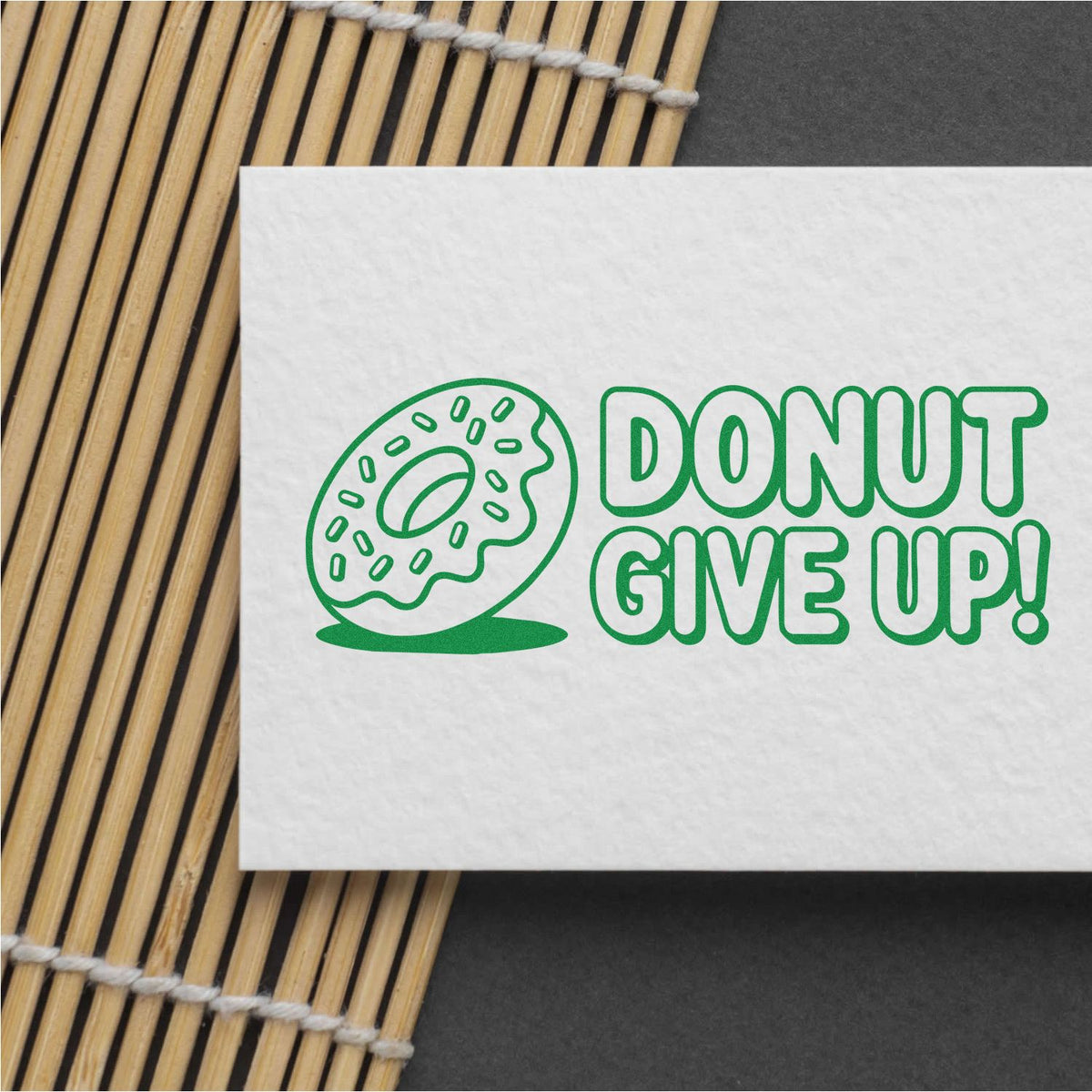 Donut Give Up rubber stamp design with donut icon and motivational text for bakery packaging and crafts.