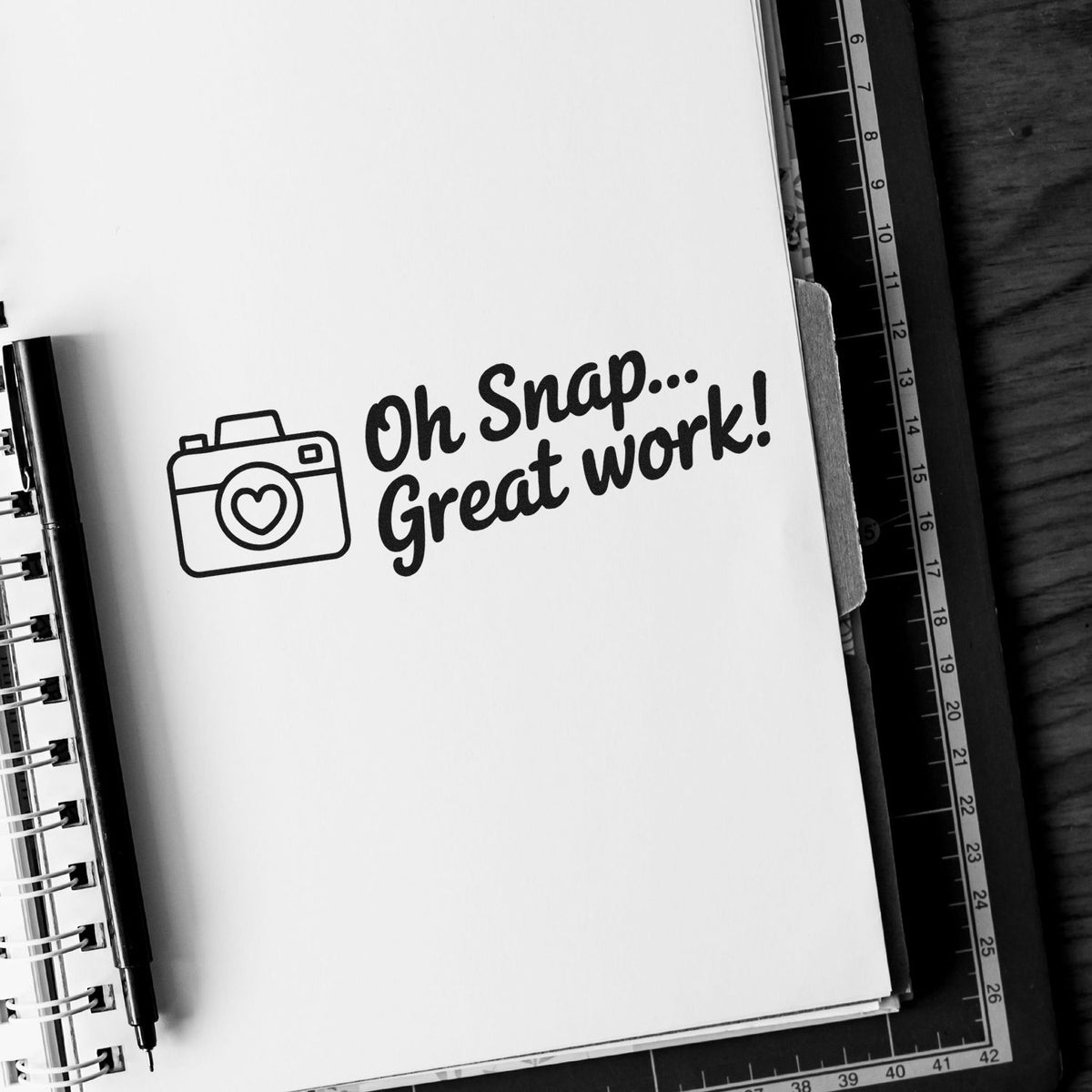 Rubber stamp design with camera icon and Oh Snap... Great work! on notebook, ideal for planners and craft projects.